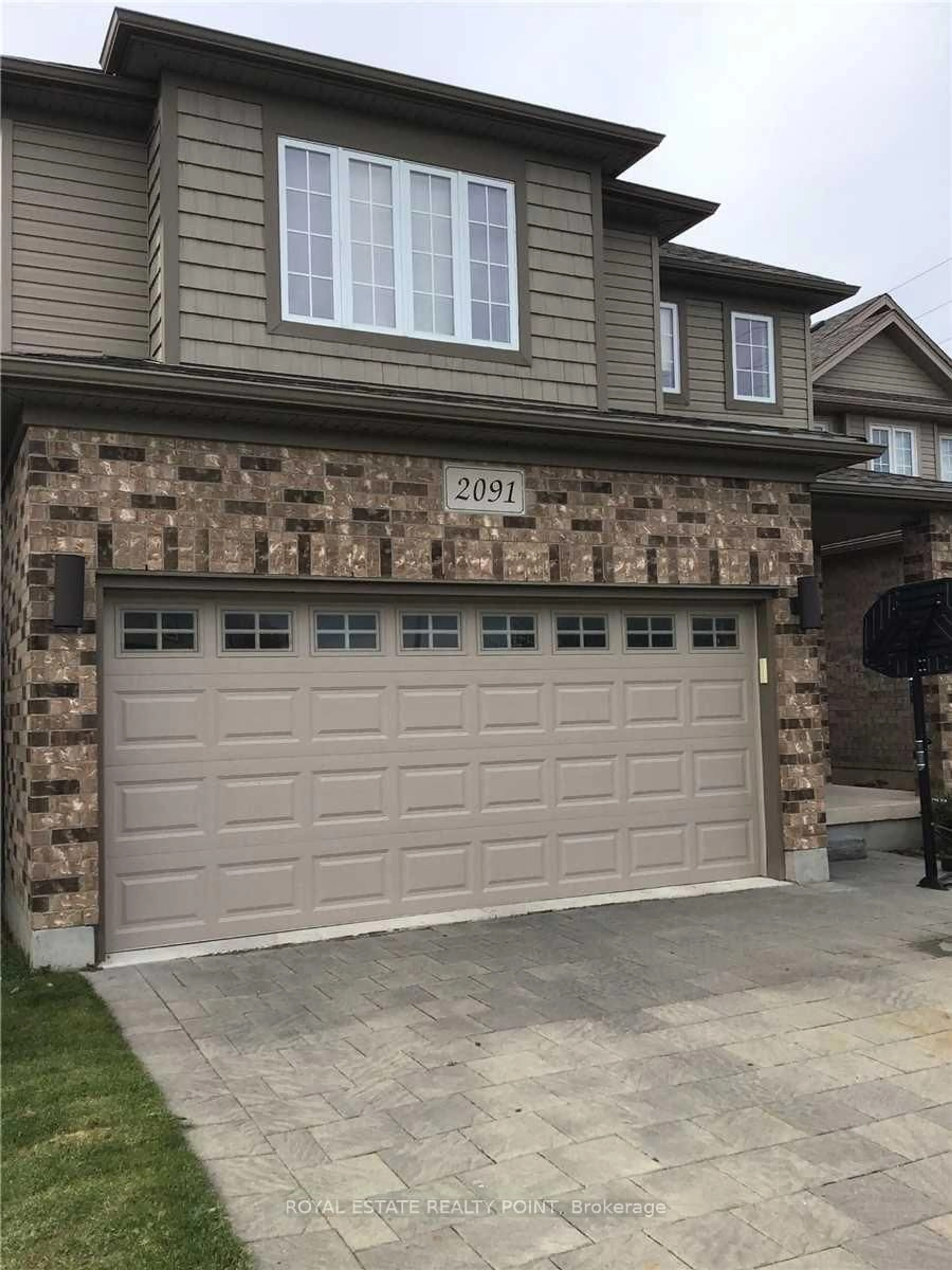 Home with brick exterior material, street for 2091 Cherrywood Tr, London North Ontario N6H 0C8