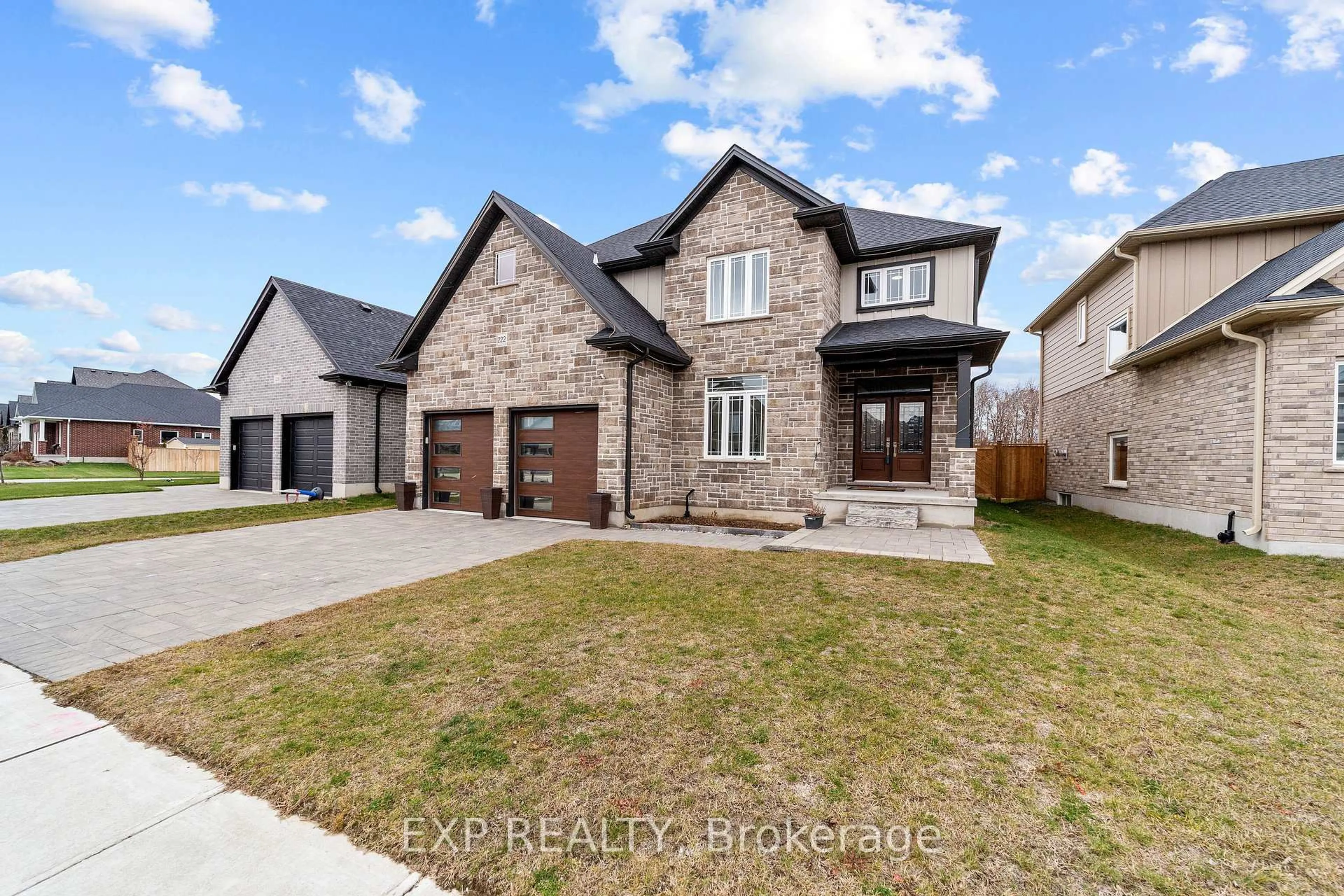 Home with brick exterior material, street for 222 Boardwalk Way, Thames Centre Ontario N0L 1G2