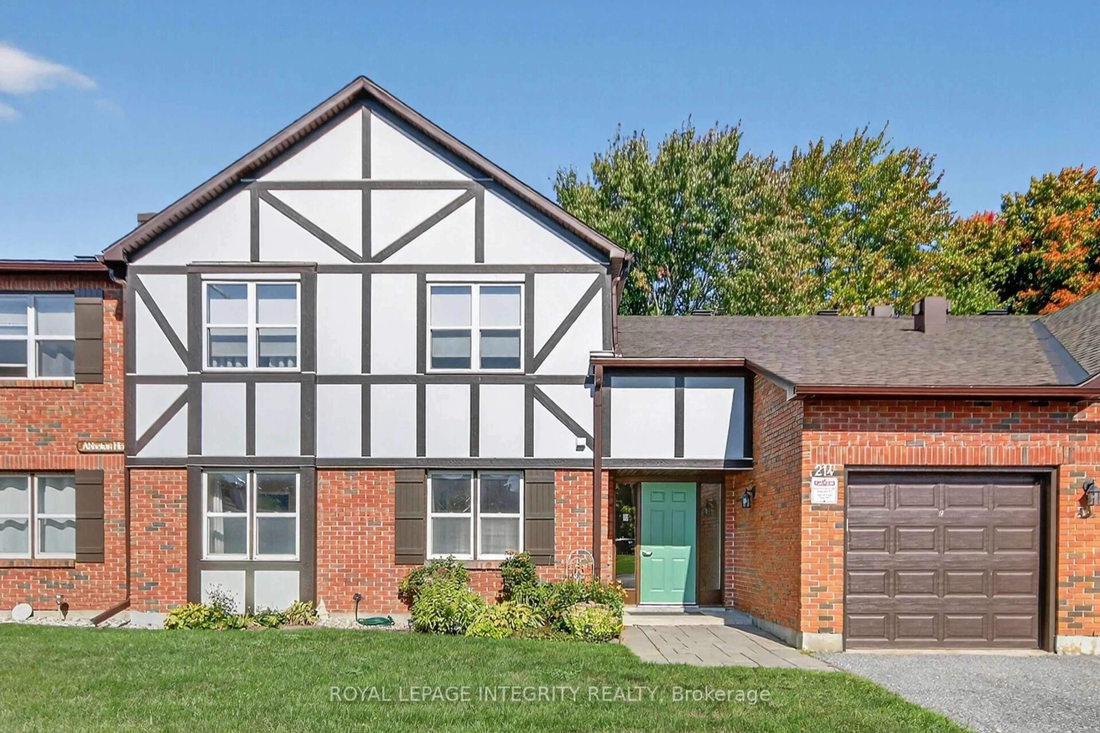 Home with brick exterior material, street for 214 Equestrian Dr #A, Ottawa Ontario K2M 1E2