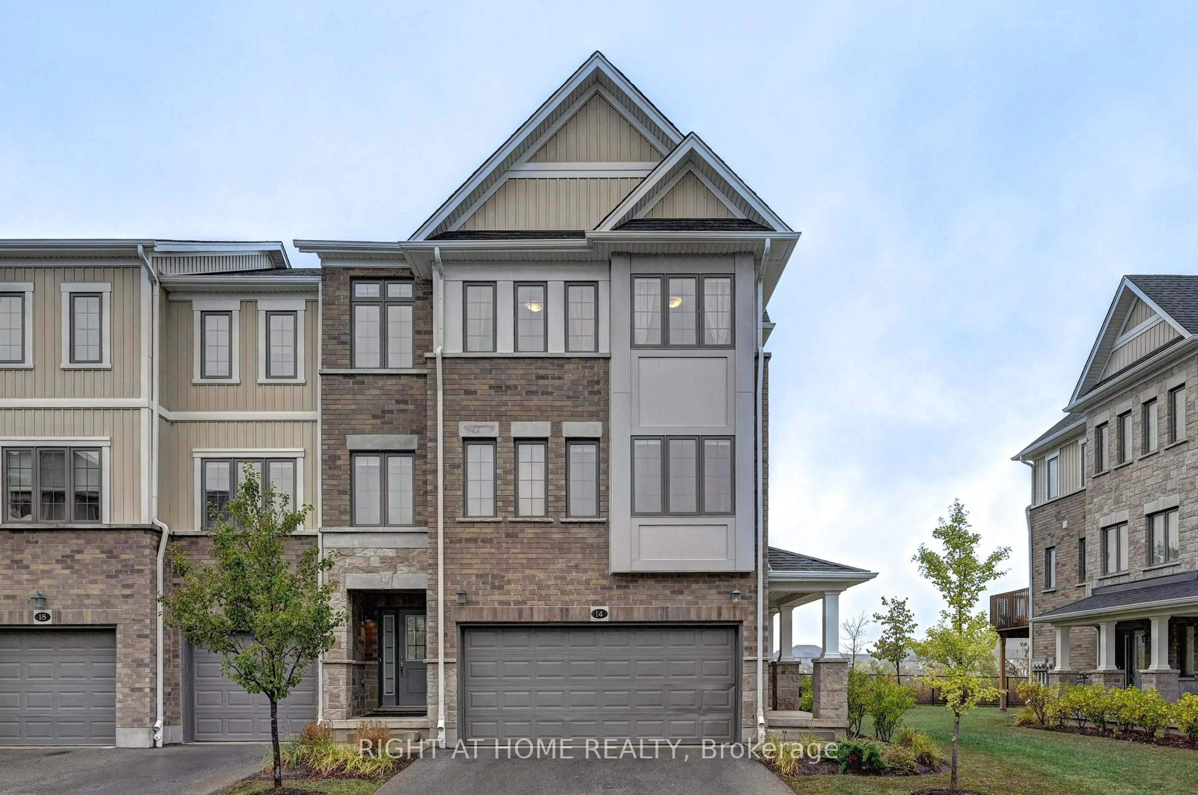 Home with brick exterior material, street for 14 Bank Swallow Cres, Kitchener Ontario N2P 0J7