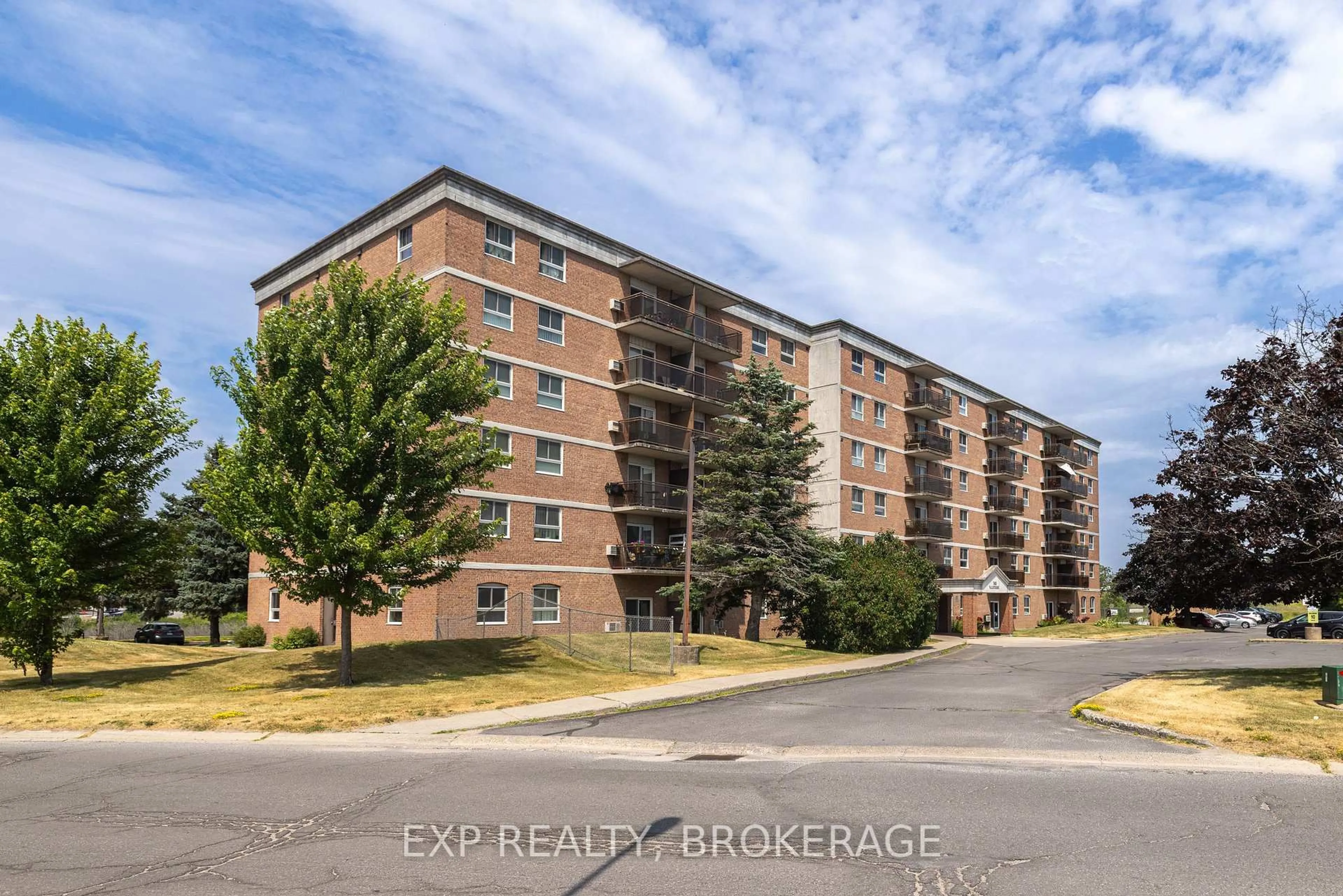 A pic from outside/outdoor area/front of a property/back of a property/a pic from drone, street for 745 Davis Dr #401, Kingston Ontario K7M 8J4