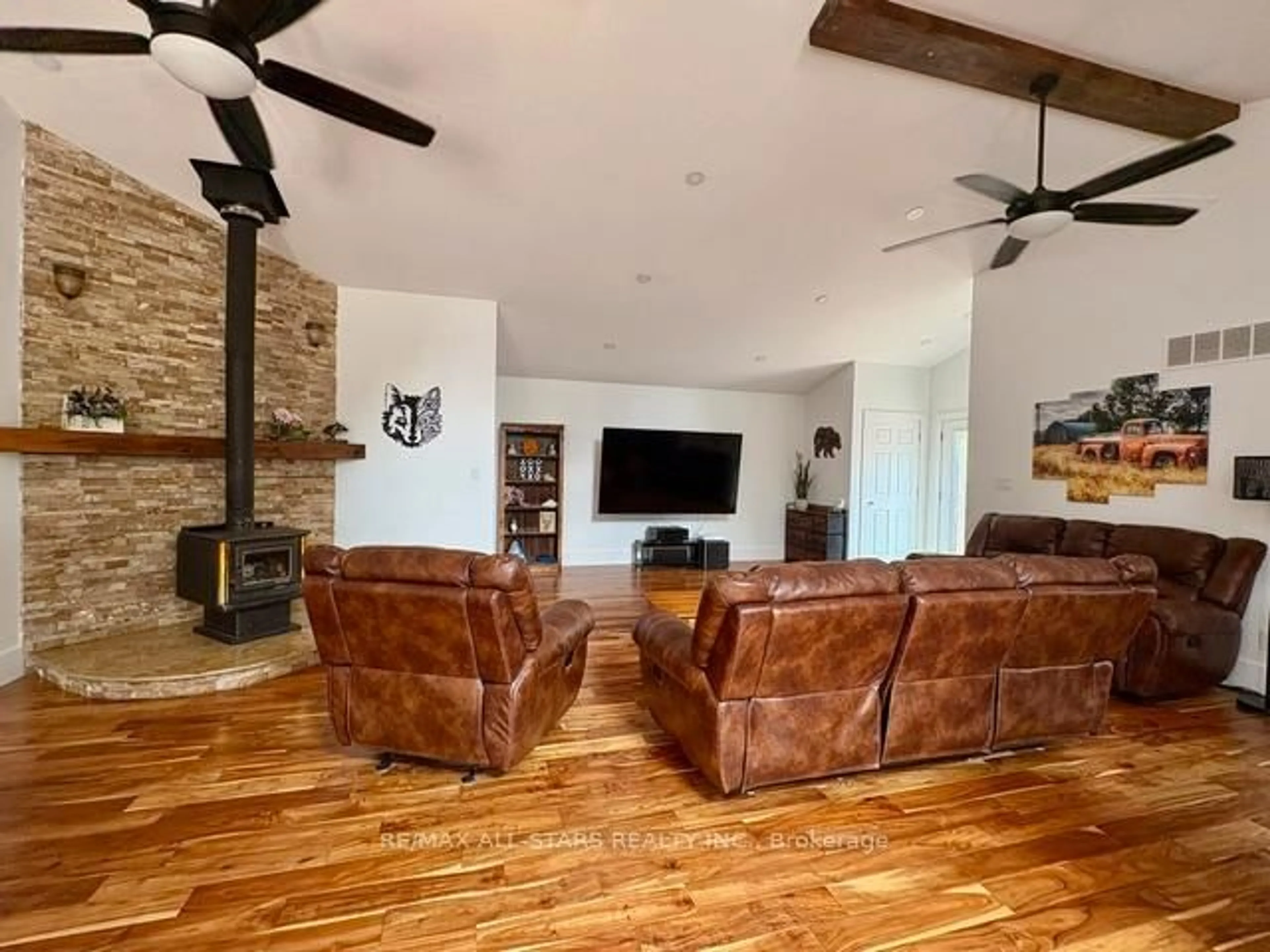 Living room with furniture, wood/laminate floor for 728 Galway Rd, Trent Lakes Ontario K0M 2A0