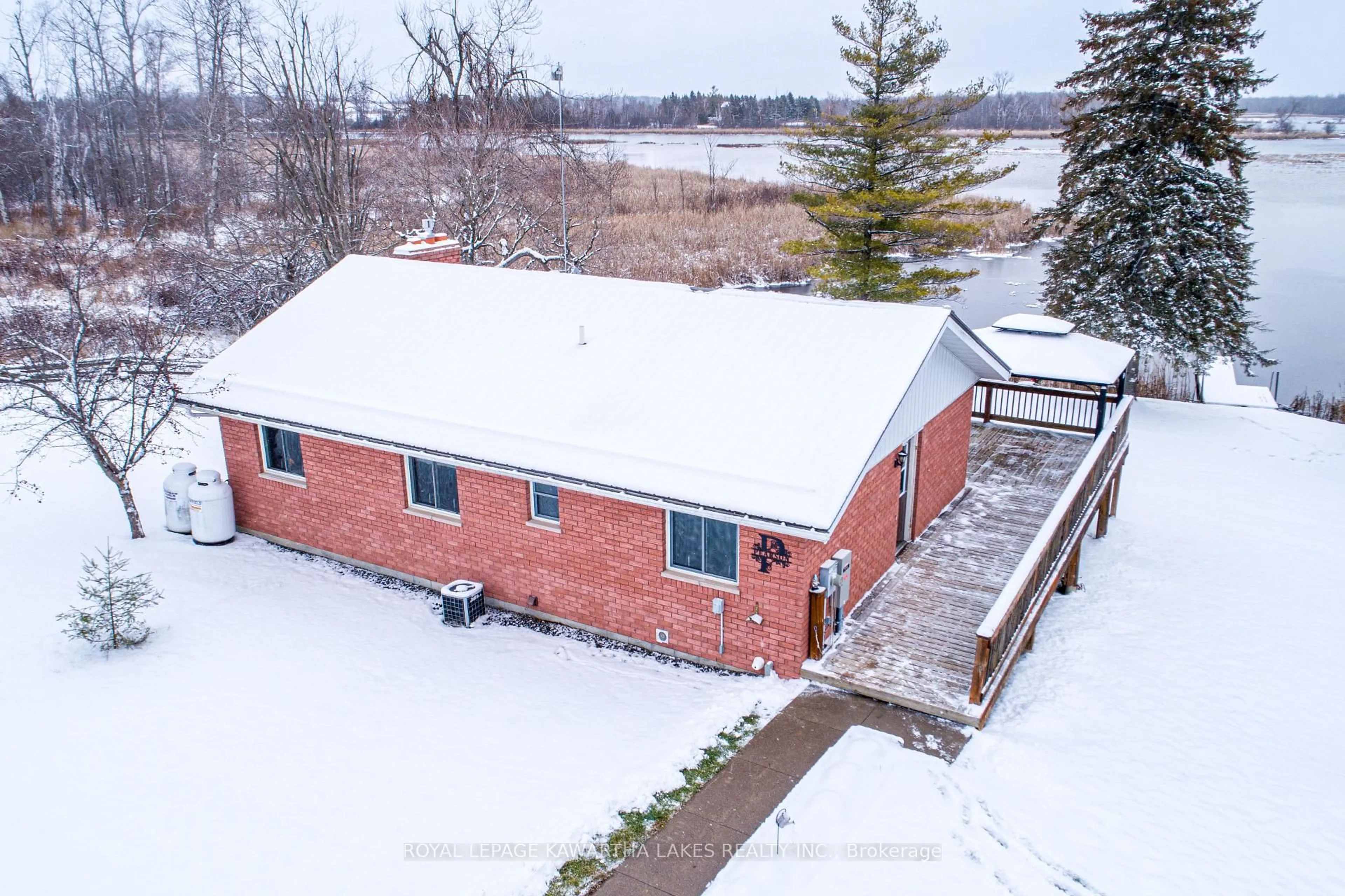 A pic from outside/outdoor area/front of a property/back of a property/a pic from drone, water/lake/river/ocean view for 1 Bridle Rd, Kawartha Lakes Ontario K9V 4R2