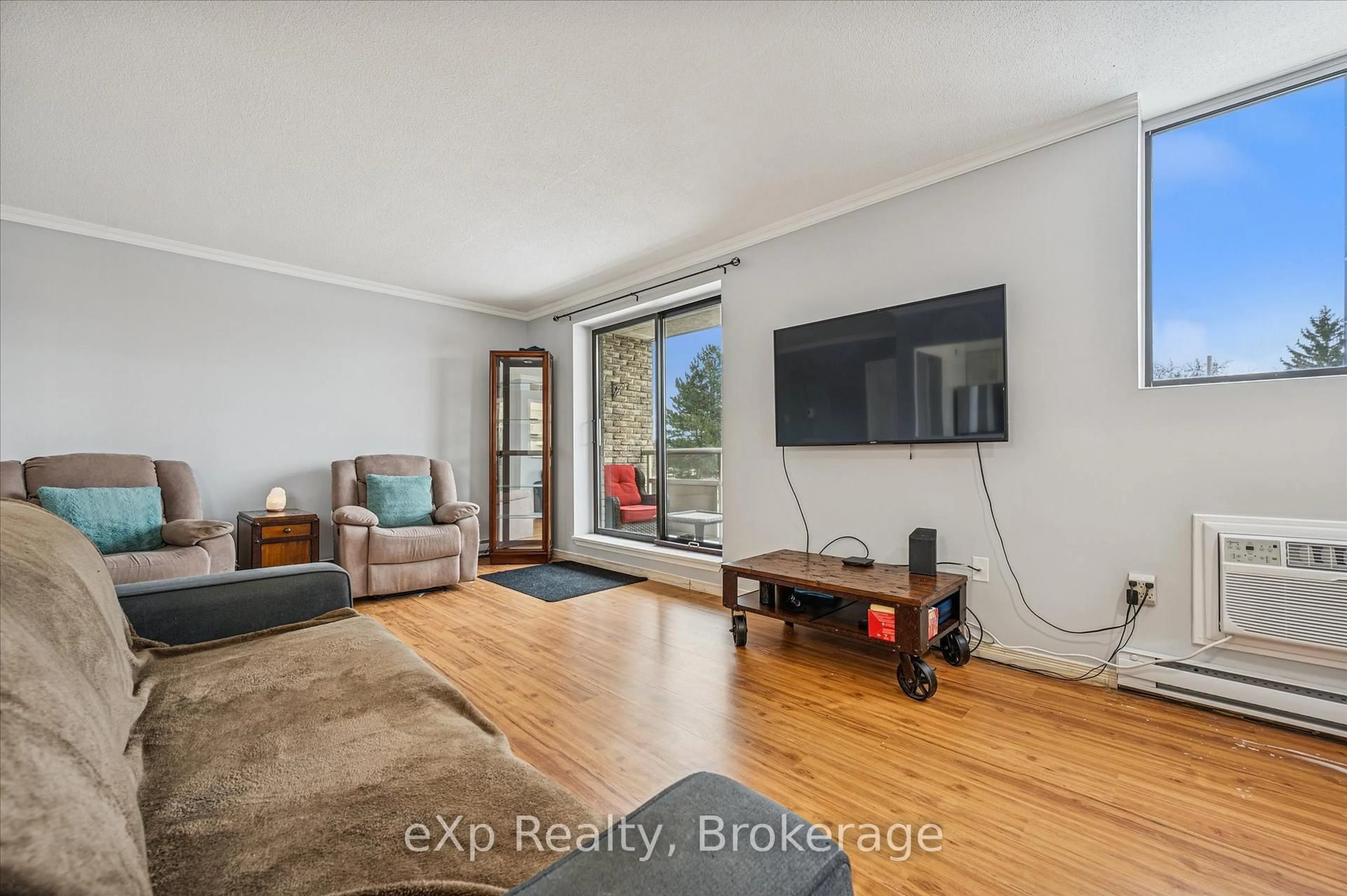 Living room with furniture, unknown for 93 Westwood Rd #301, Guelph Ontario N1H 7J7