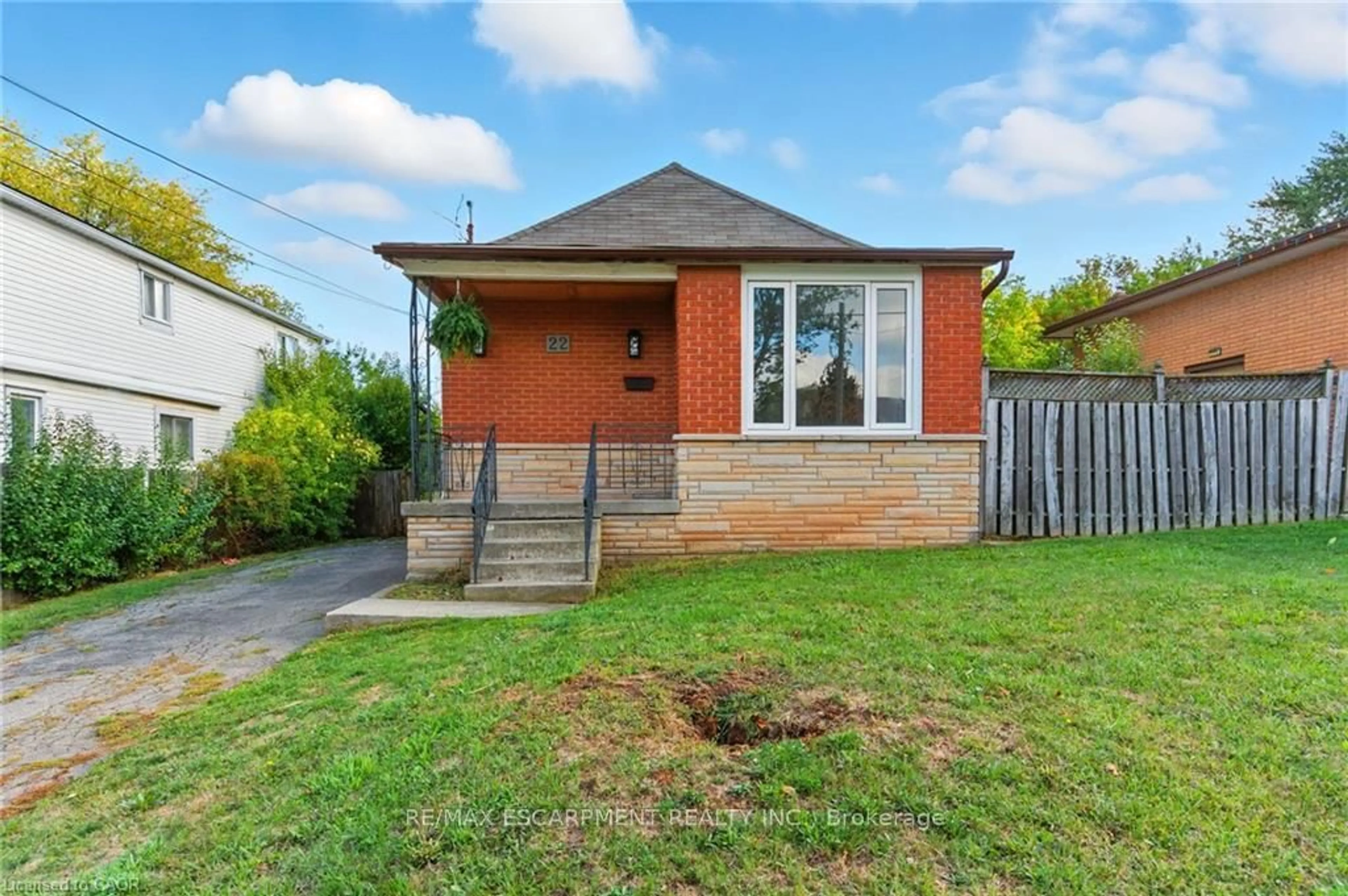 Home with brick exterior material, street for 22 Worsley Rd, Hamilton Ontario L8E 2E7