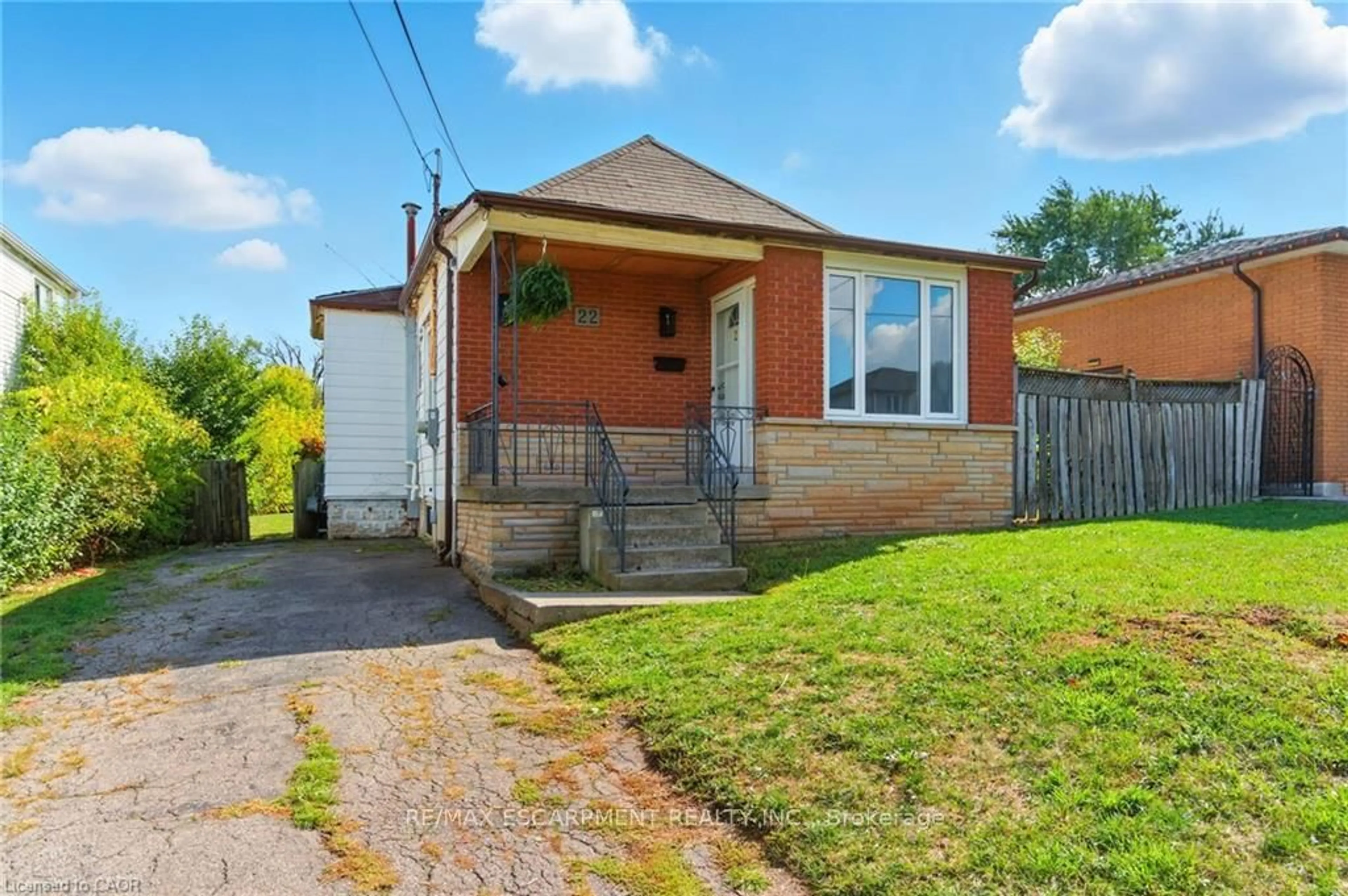 Home with brick exterior material, street for 22 Worsley Rd, Hamilton Ontario L8E 2E7