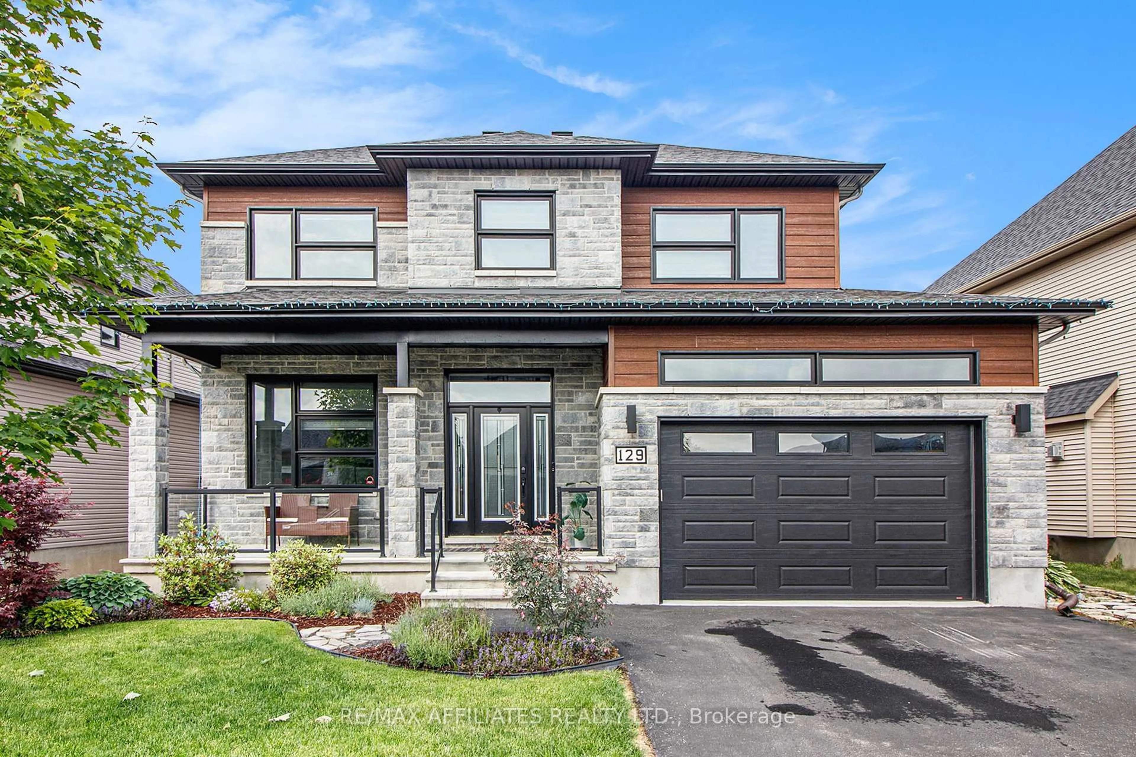 Home with brick exterior material, street for 129 Lyon St, Russell Ontario K0A 1W0