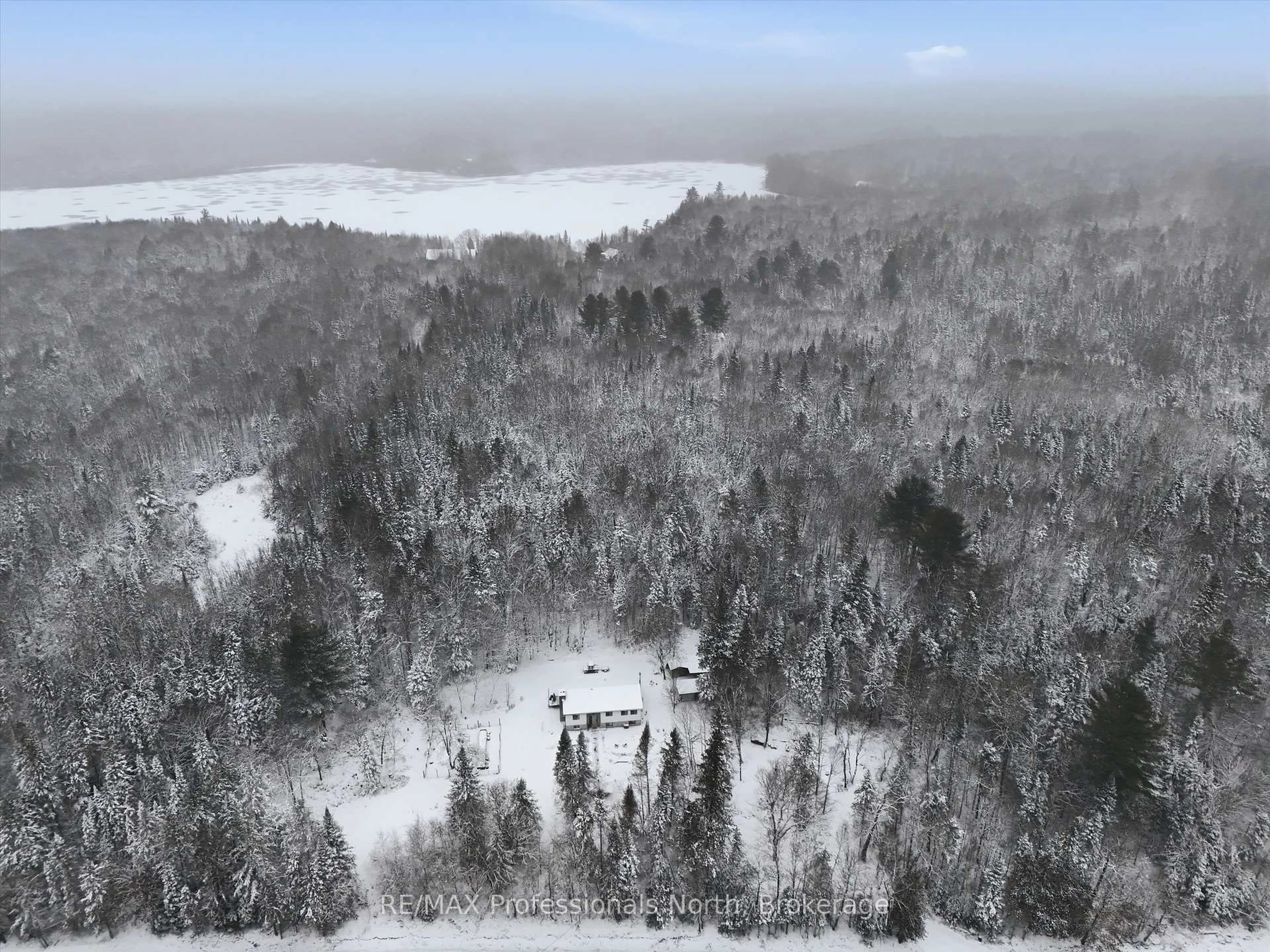 A pic from outside/outdoor area/front of a property/back of a property/a pic from drone, forest/trees view for 966 Boundary Rd, Huntsville Ontario P0A 1R0