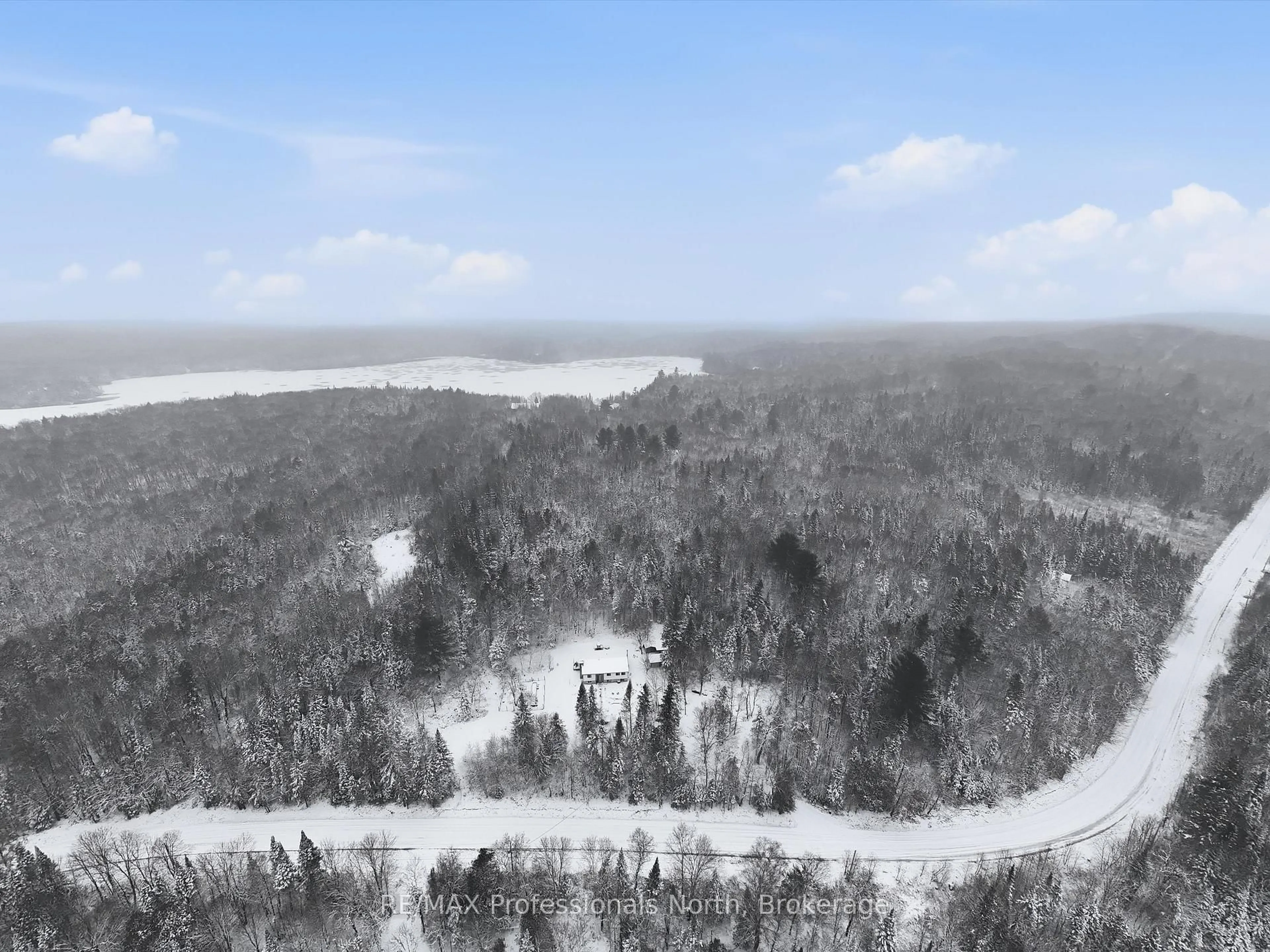 A pic from outside/outdoor area/front of a property/back of a property/a pic from drone, forest/trees view for 966 Boundary Rd, Huntsville Ontario P0A 1R0