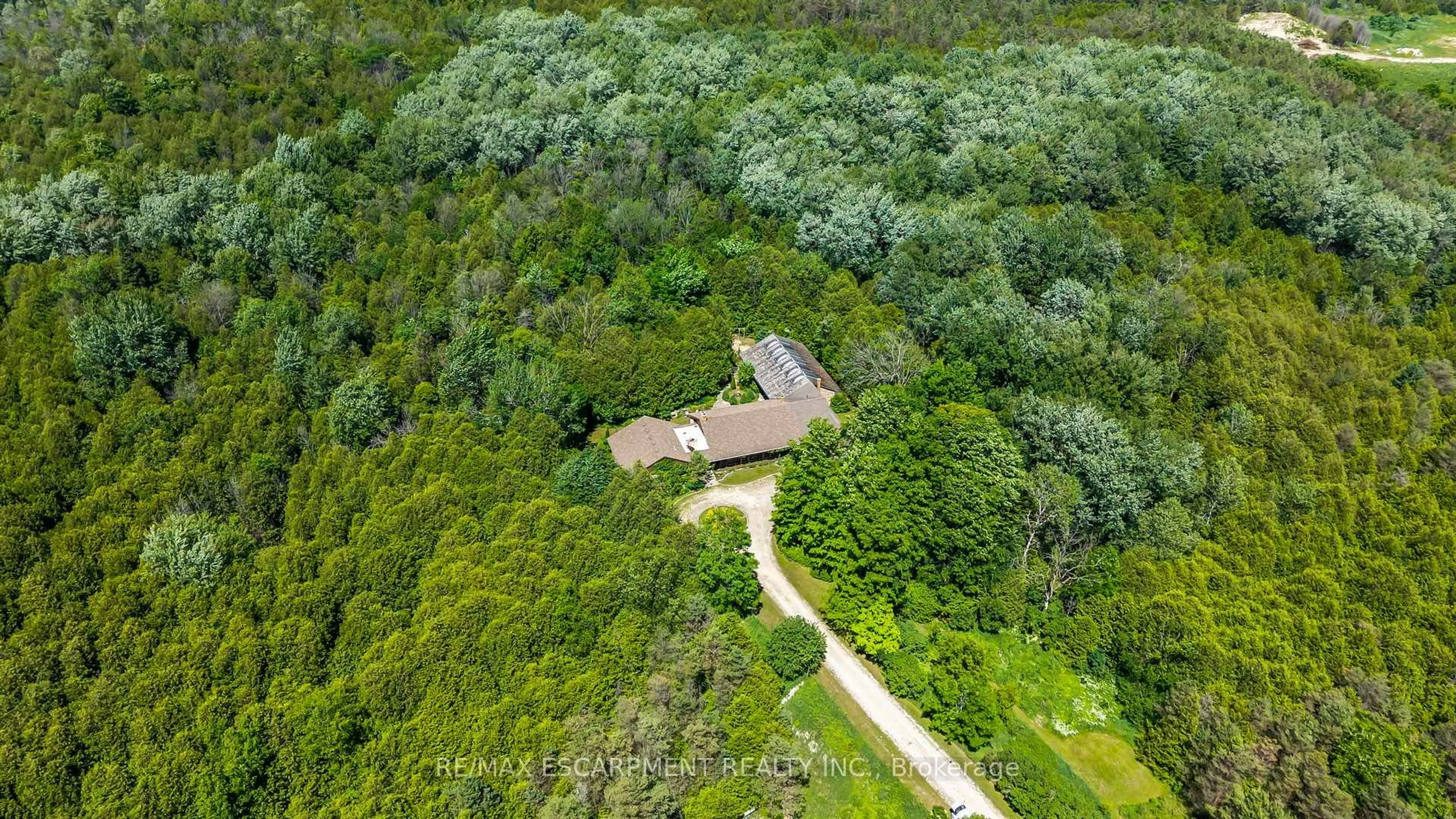 A pic from outside/outdoor area/front of a property/back of a property/a pic from drone, forest/trees view for 302783 Douglas St, West Grey Ontario N0G 1R0