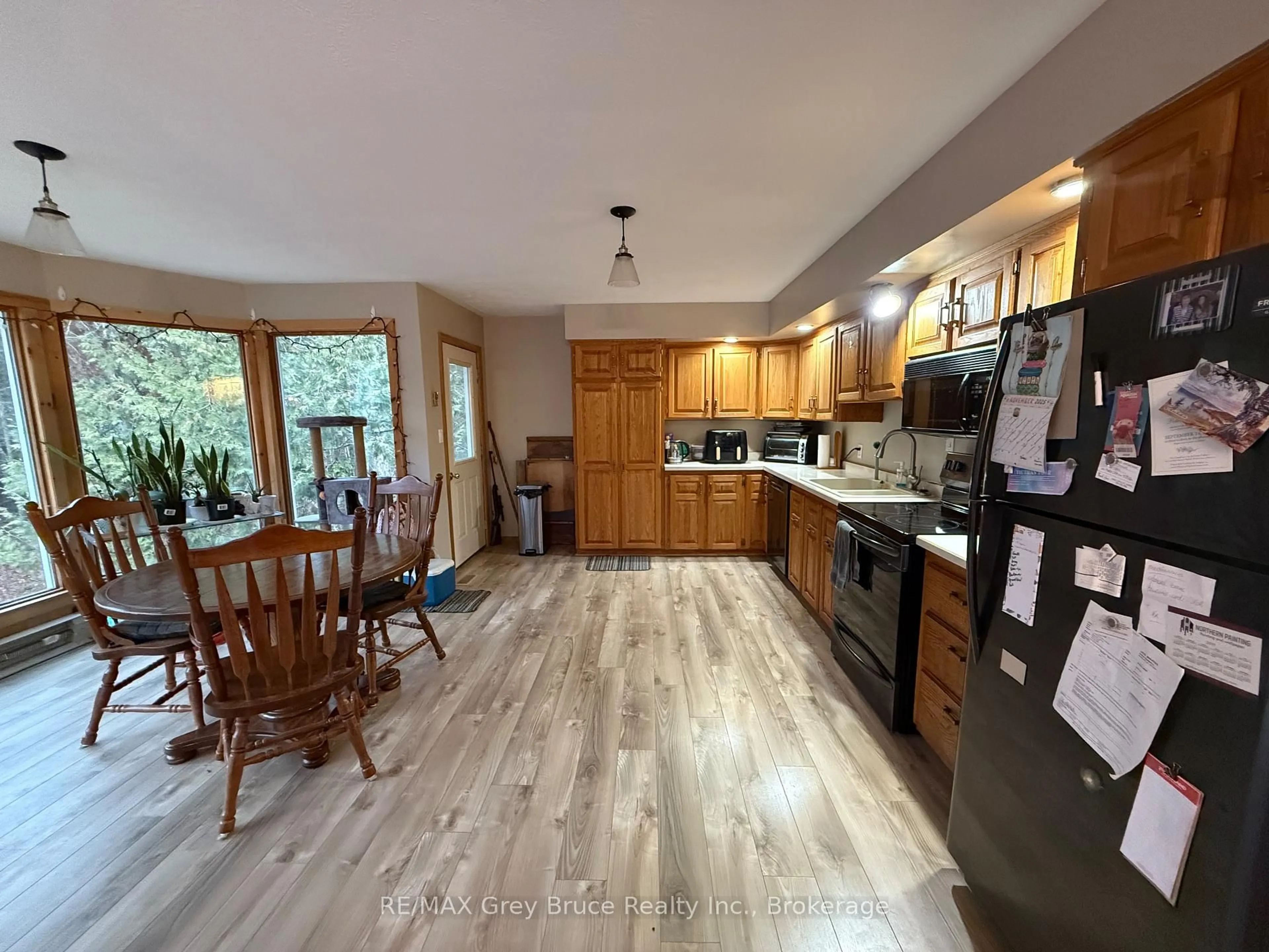 Open concept kitchen, wood/laminate floor for 210 Cape Hurd Rd, Northern Bruce Peninsula Ontario N0H 2R0