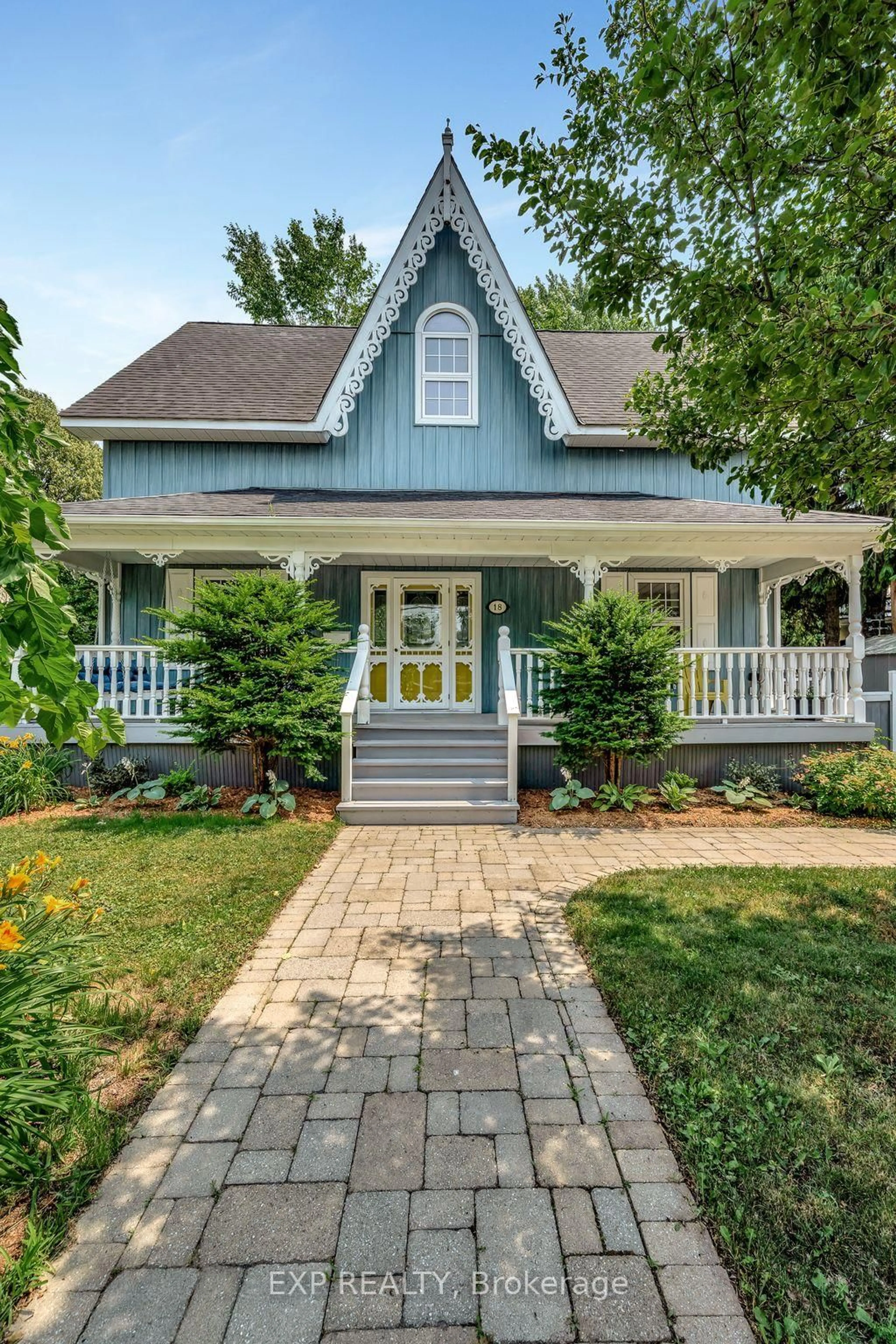 Home with vinyl exterior material, street for 18 Queen St, Prince Edward County Ontario K0K 2T0