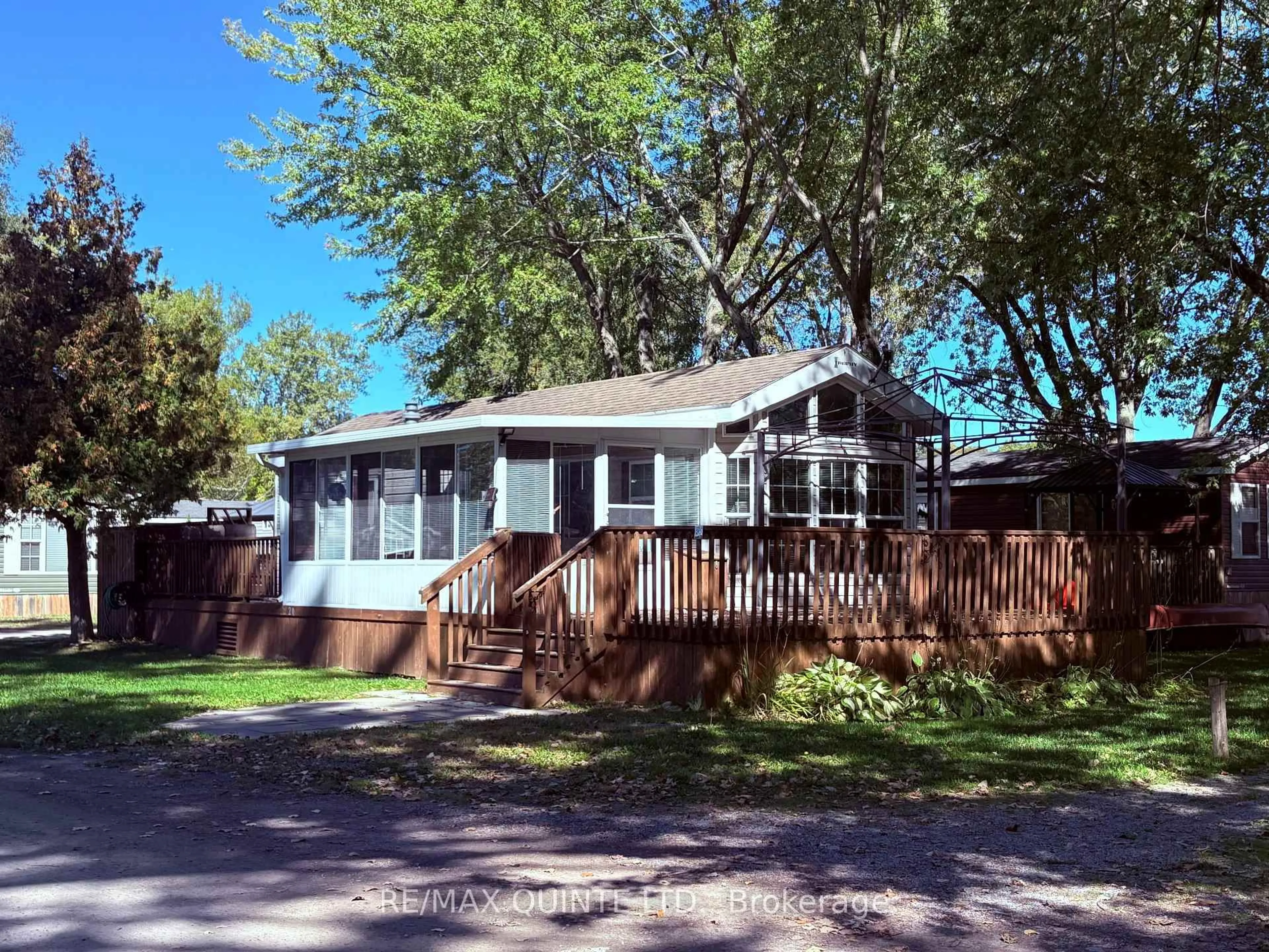 Home with vinyl exterior material, street for 486 County Rd 18 Rd #20 Cherry Beach Lane, Prince Edward County Ontario K0K 1P0