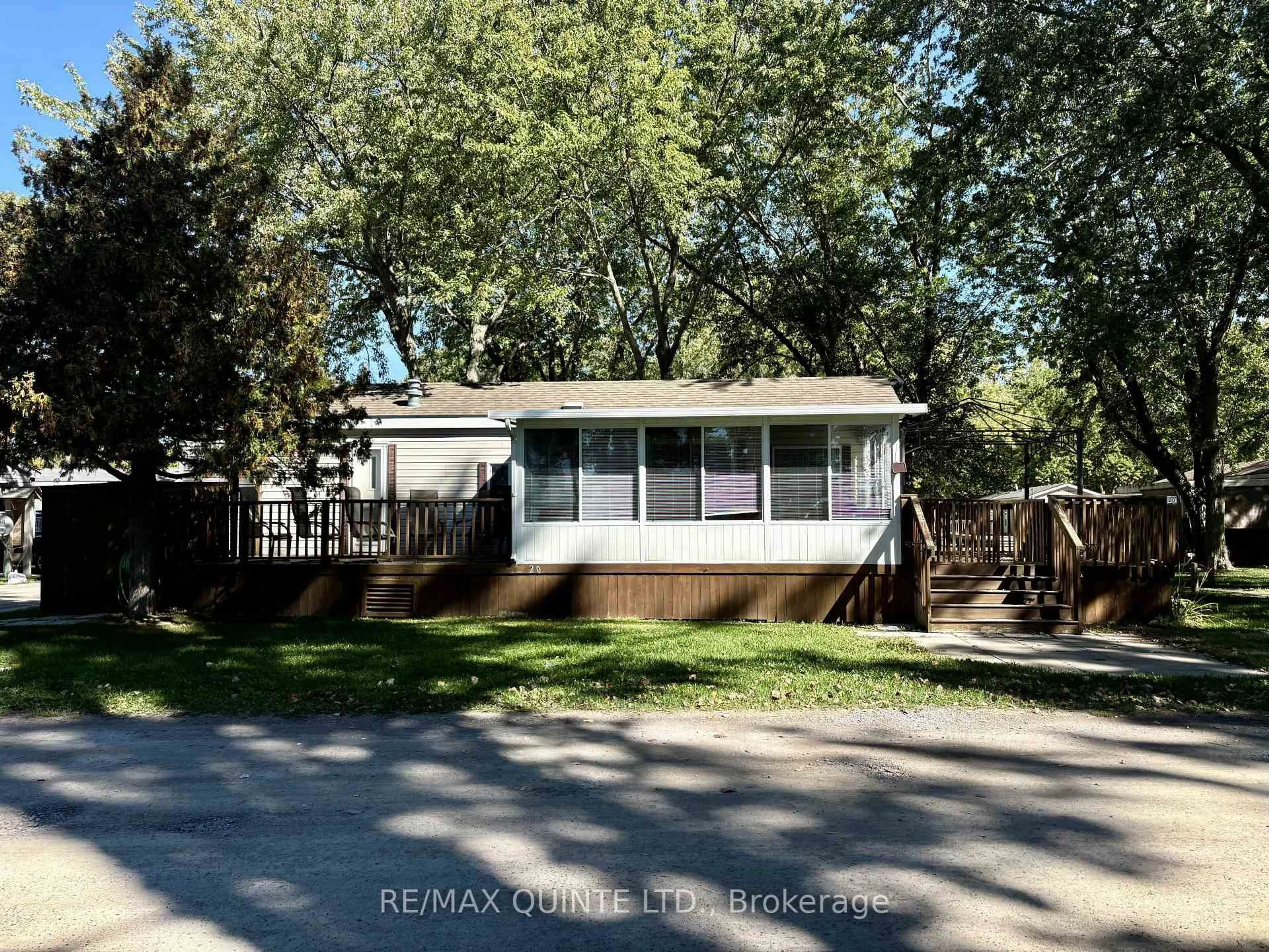 Home with vinyl exterior material, street for 486 County Rd 18 Rd #20 Cherry Beach Lane, Prince Edward County Ontario K0K 1P0