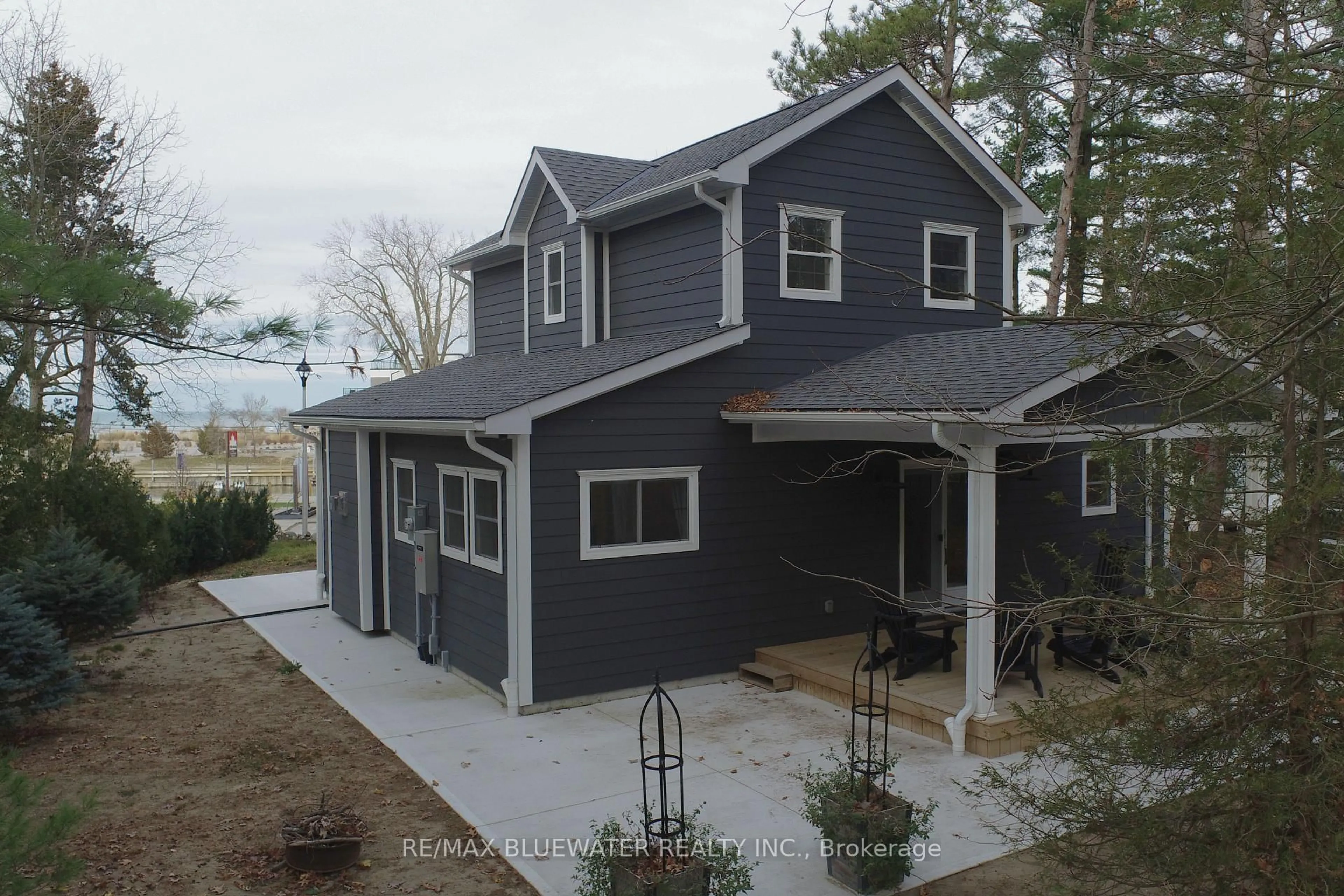 Home with vinyl exterior material, street for 82 River Rd, Lambton Shores Ontario N0M 1T0