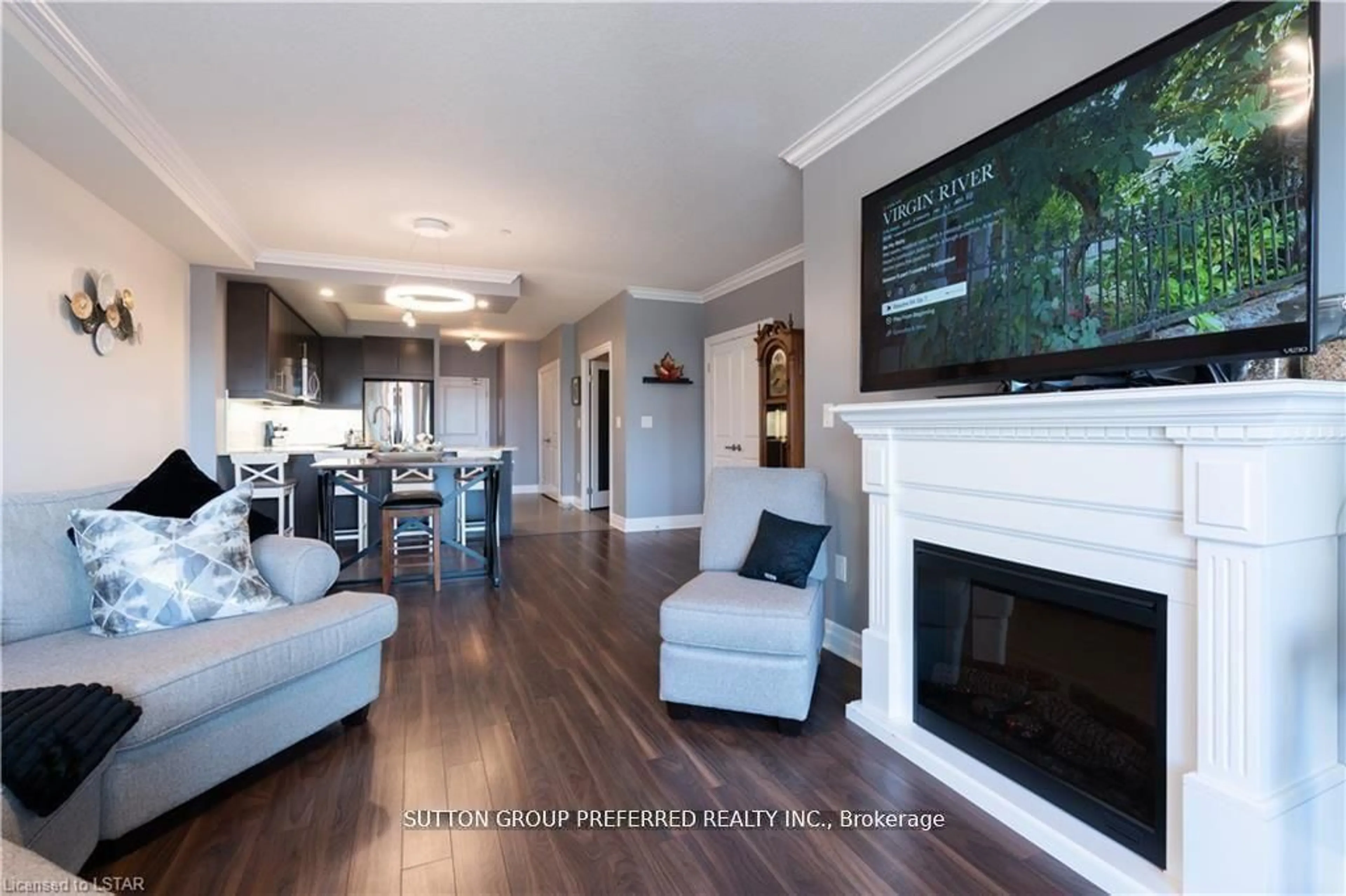 Living room with furniture, wood/laminate floor for 260 Villagewalk Blvd #308, London North Ontario N6G 0W6