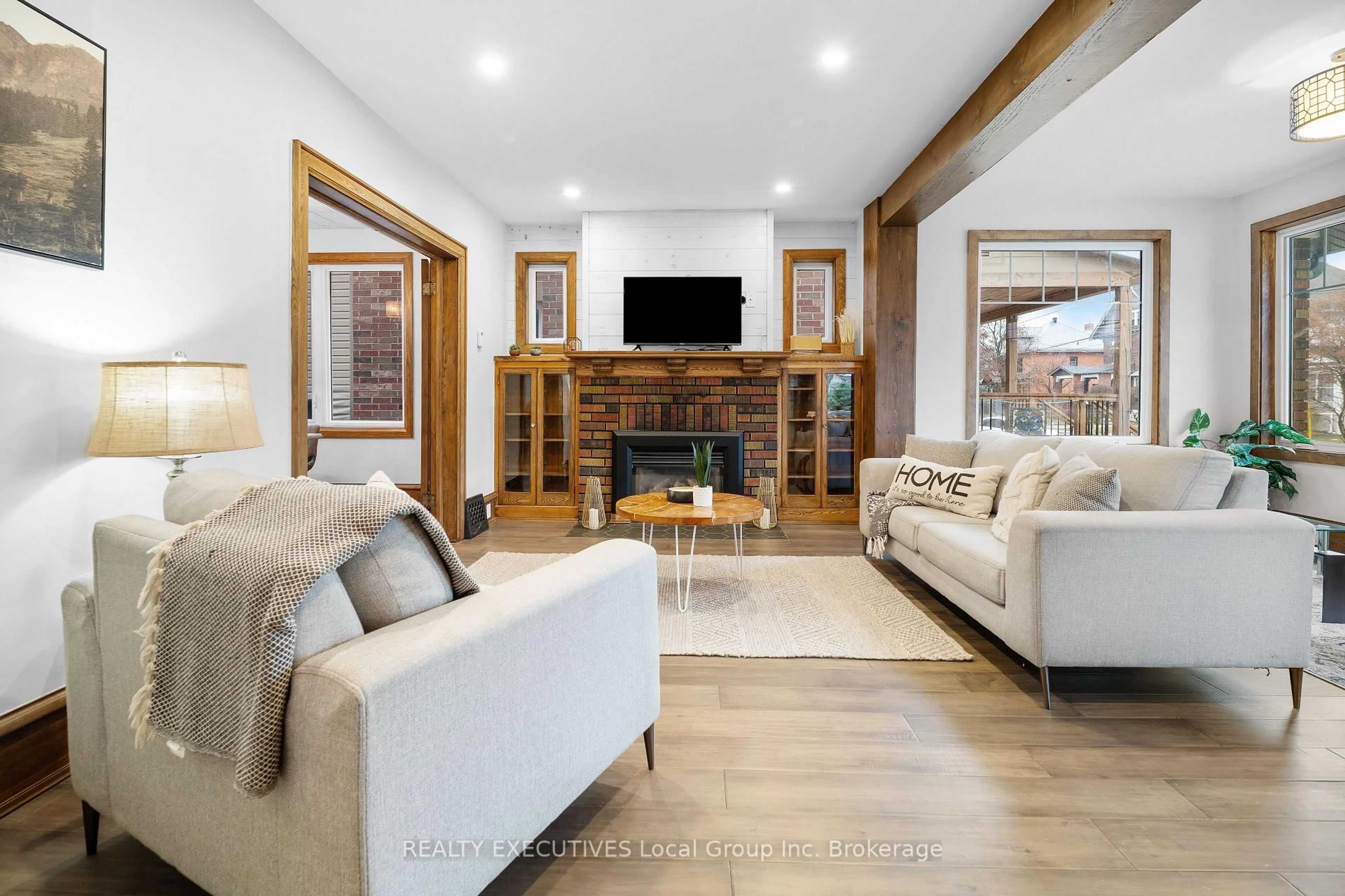 Living room with furniture, wood/laminate floor for 537 COPELAND St, North Bay Ontario P1B 3C7