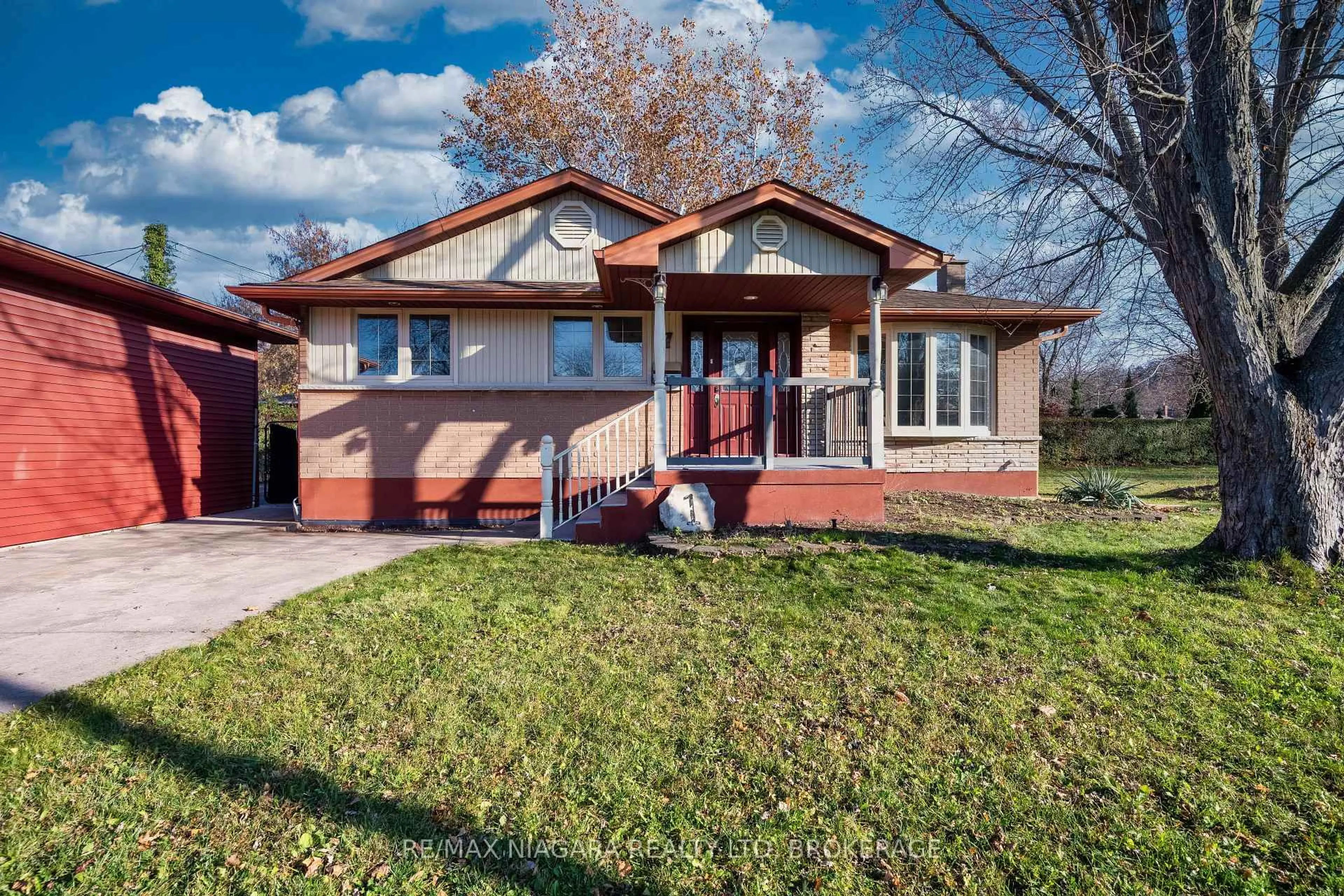 Home with brick exterior material, street for 1 East Hampton Rd, St. Catharines Ontario L2T 3C9