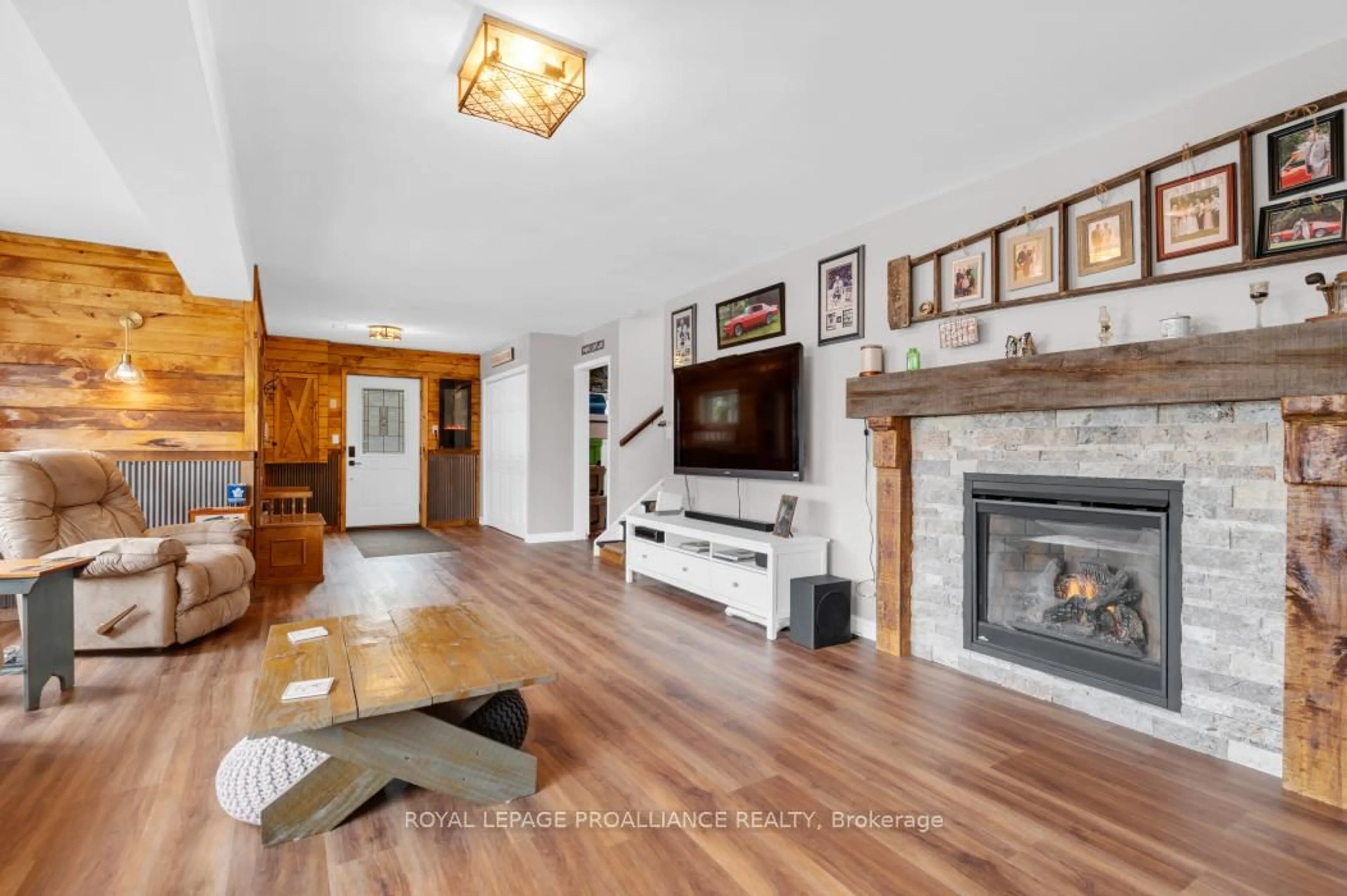 Living room with furniture, wood/laminate floor for 17206 Highway 41, Cloyne Ontario K0H 1K0