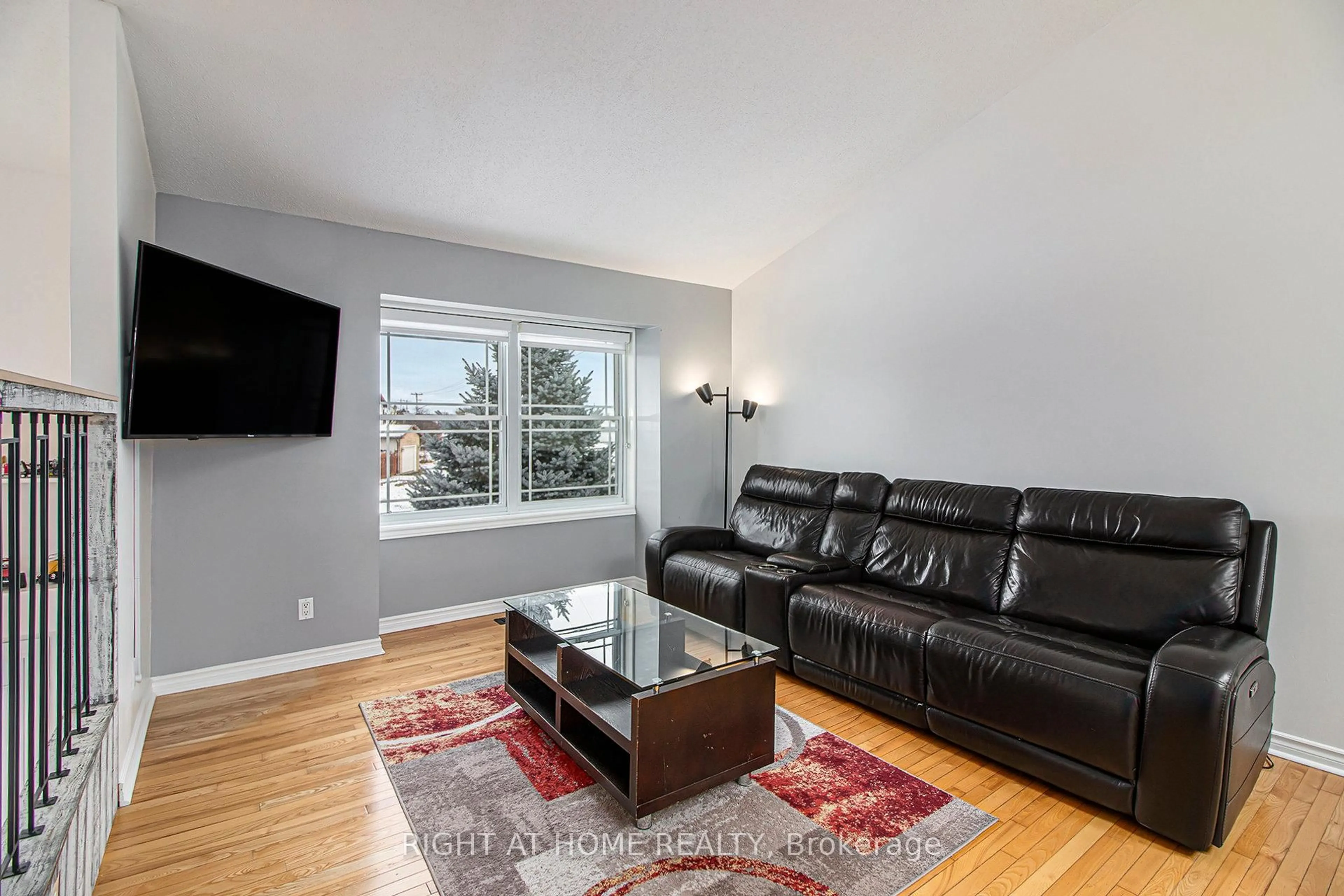 Living room with furniture, wood/laminate floor for 55 Isabelle Rd, Casselman Ontario K0A 1M0