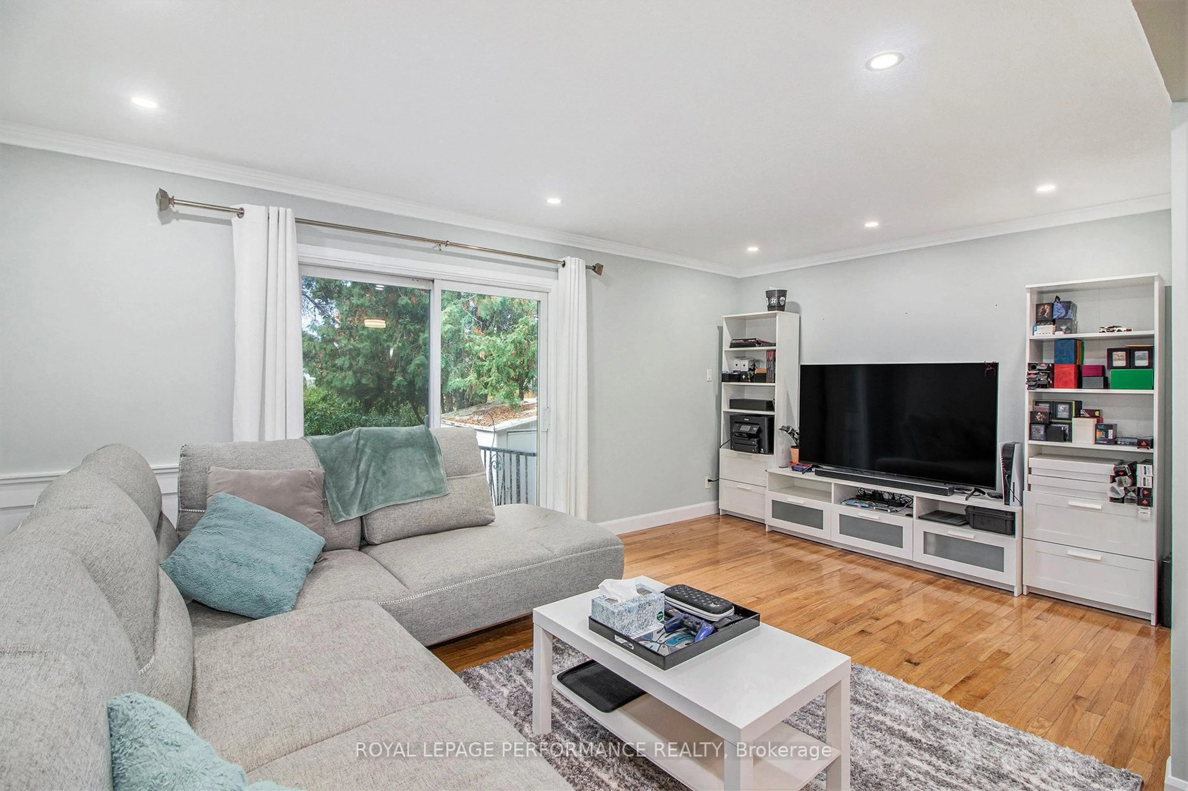 Living room with furniture, wood/laminate floor for 6181 Brookside Lane, Ottawa Ontario K1C 2K6