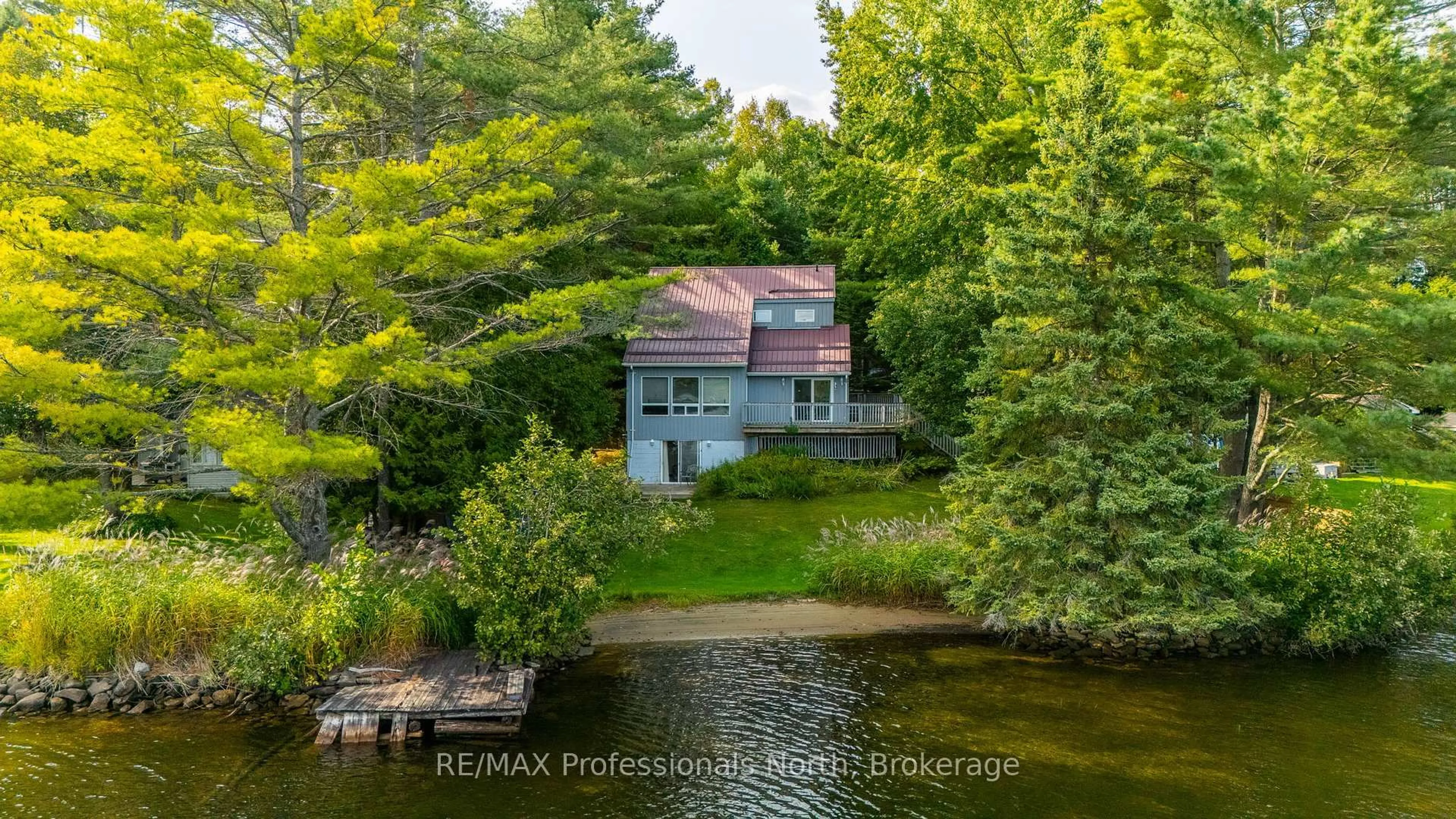 A pic from outside/outdoor area/front of a property/back of a property/a pic from drone, water/lake/river/ocean view for 1080 Petticoat Lane, Minden Hills Ontario K0M 2K0