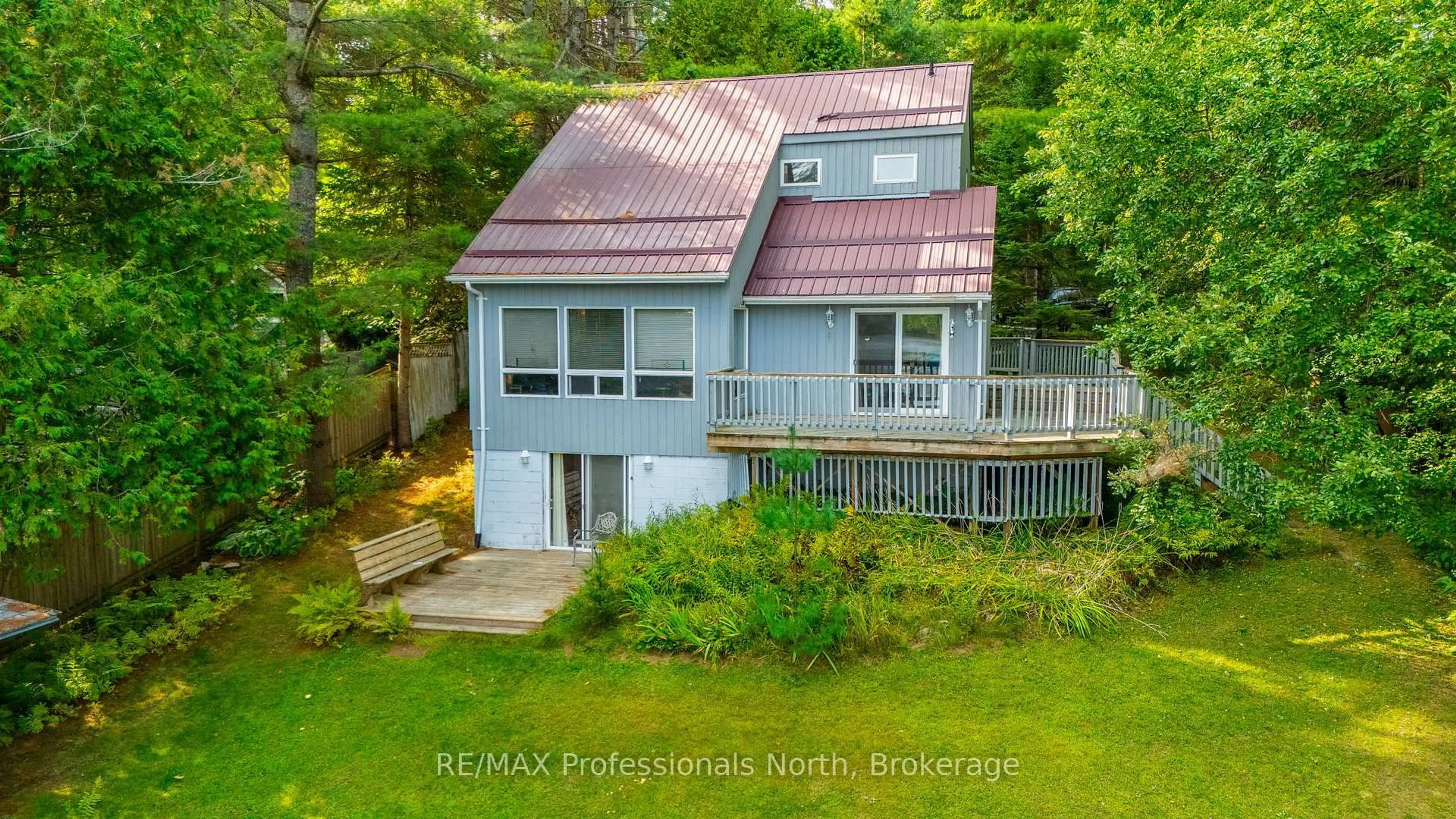 A pic from outside/outdoor area/front of a property/back of a property/a pic from drone, water/lake/river/ocean view for 1080 Petticoat Lane, Minden Hills Ontario K0M 2K0