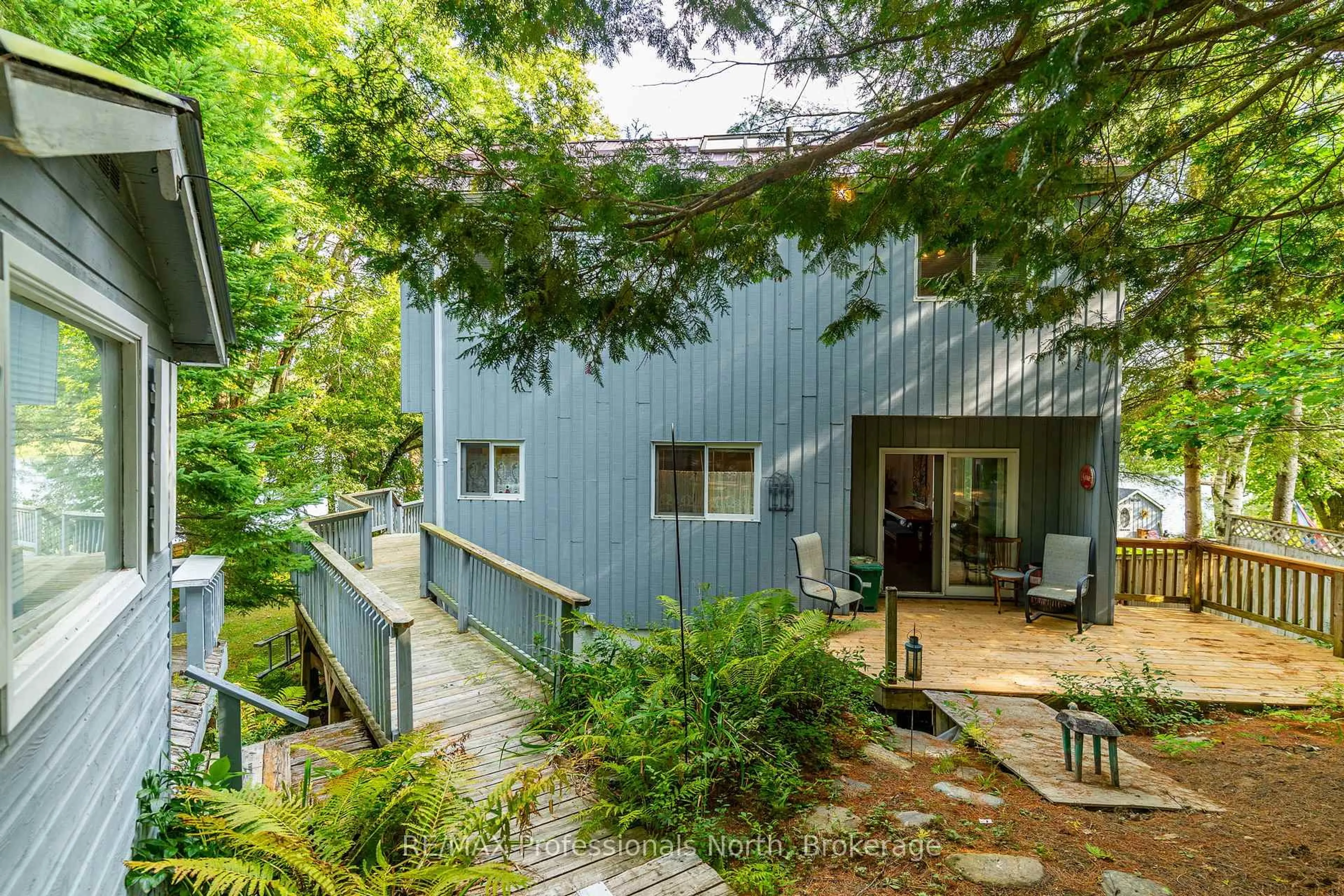 A pic from outside/outdoor area/front of a property/back of a property/a pic from drone, forest/trees view for 1080 Petticoat Lane, Minden Hills Ontario K0M 2K0