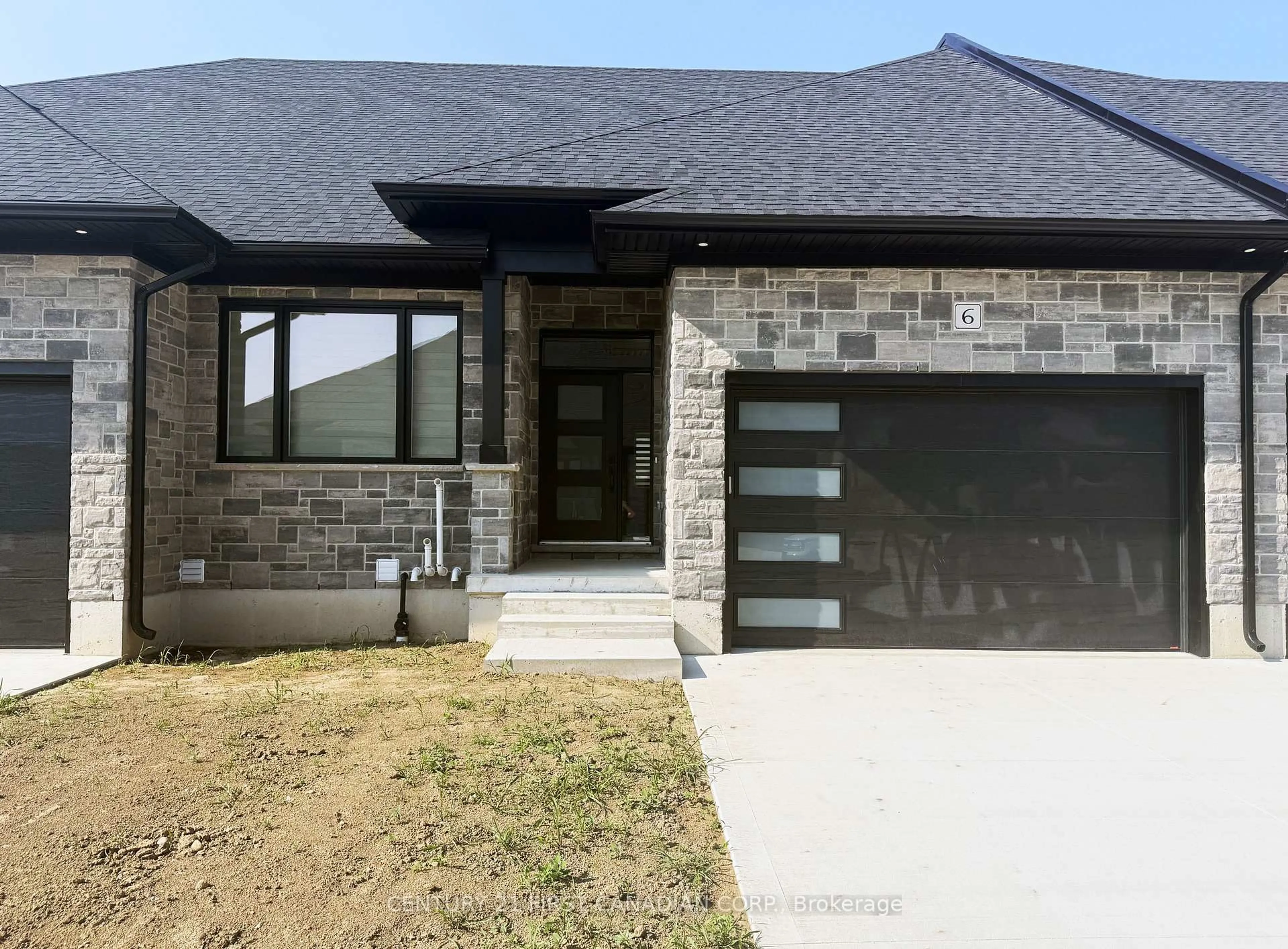 Home with brick exterior material, street for 32 Postma St #6, North Middlesex Ontario N0M 1A0