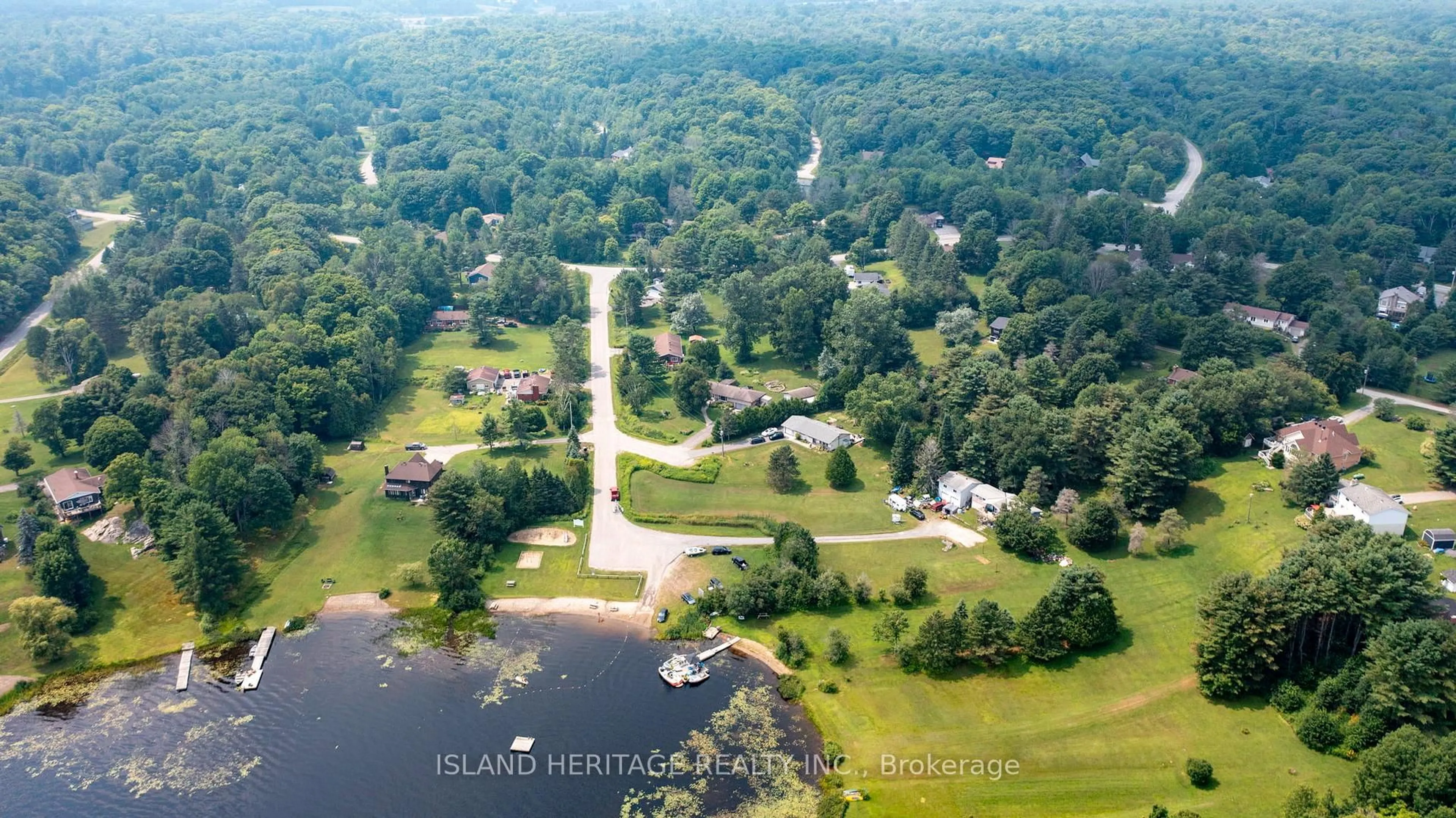 A pic from outside/outdoor area/front of a property/back of a property/a pic from drone, water/lake/river/ocean view for 5 Linney Lane, McDougall Ontario P2A 2W9
