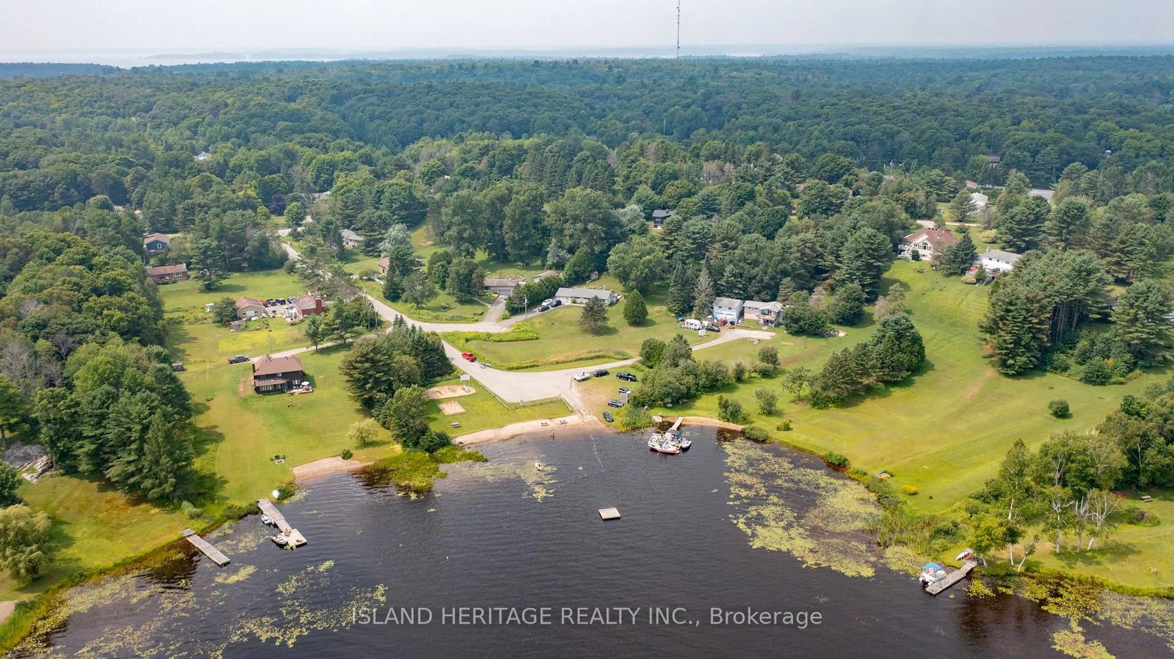 A pic from outside/outdoor area/front of a property/back of a property/a pic from drone, water/lake/river/ocean view for 5 Linney Lane, McDougall Ontario P2A 2W9