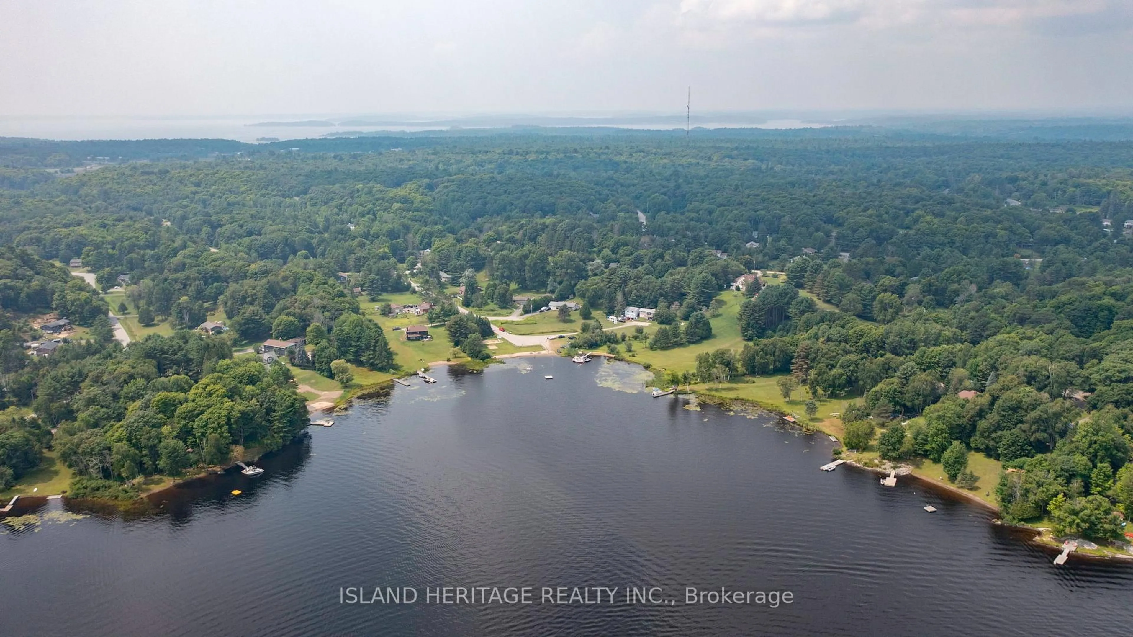 A pic from outside/outdoor area/front of a property/back of a property/a pic from drone, water/lake/river/ocean view for 5 Linney Lane, McDougall Ontario P2A 2W9