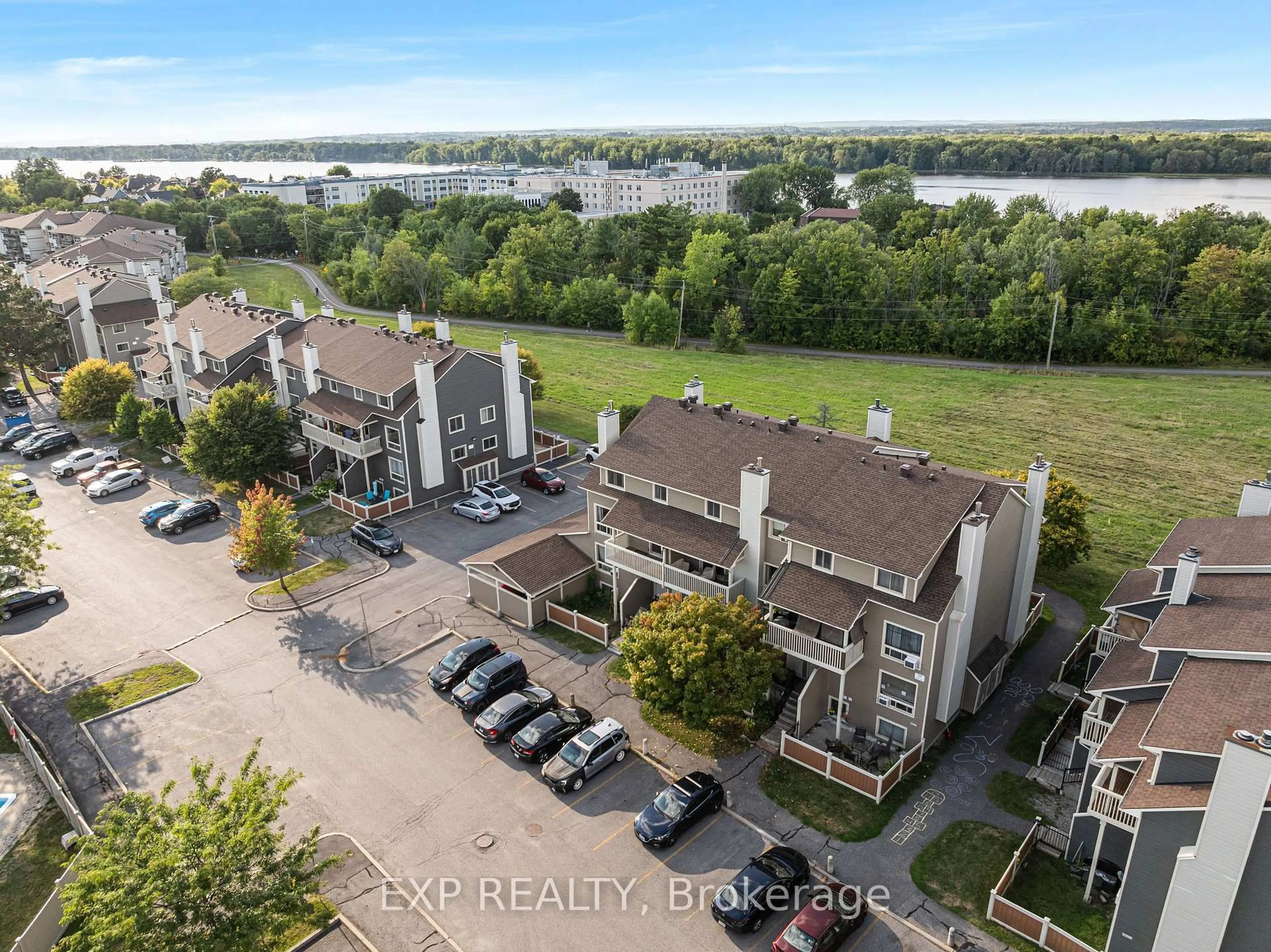 A pic from outside/outdoor area/front of a property/back of a property/a pic from drone, water/lake/river/ocean view for 754 St. Andre Dr #77B, Orleans Ontario K1C 4S4