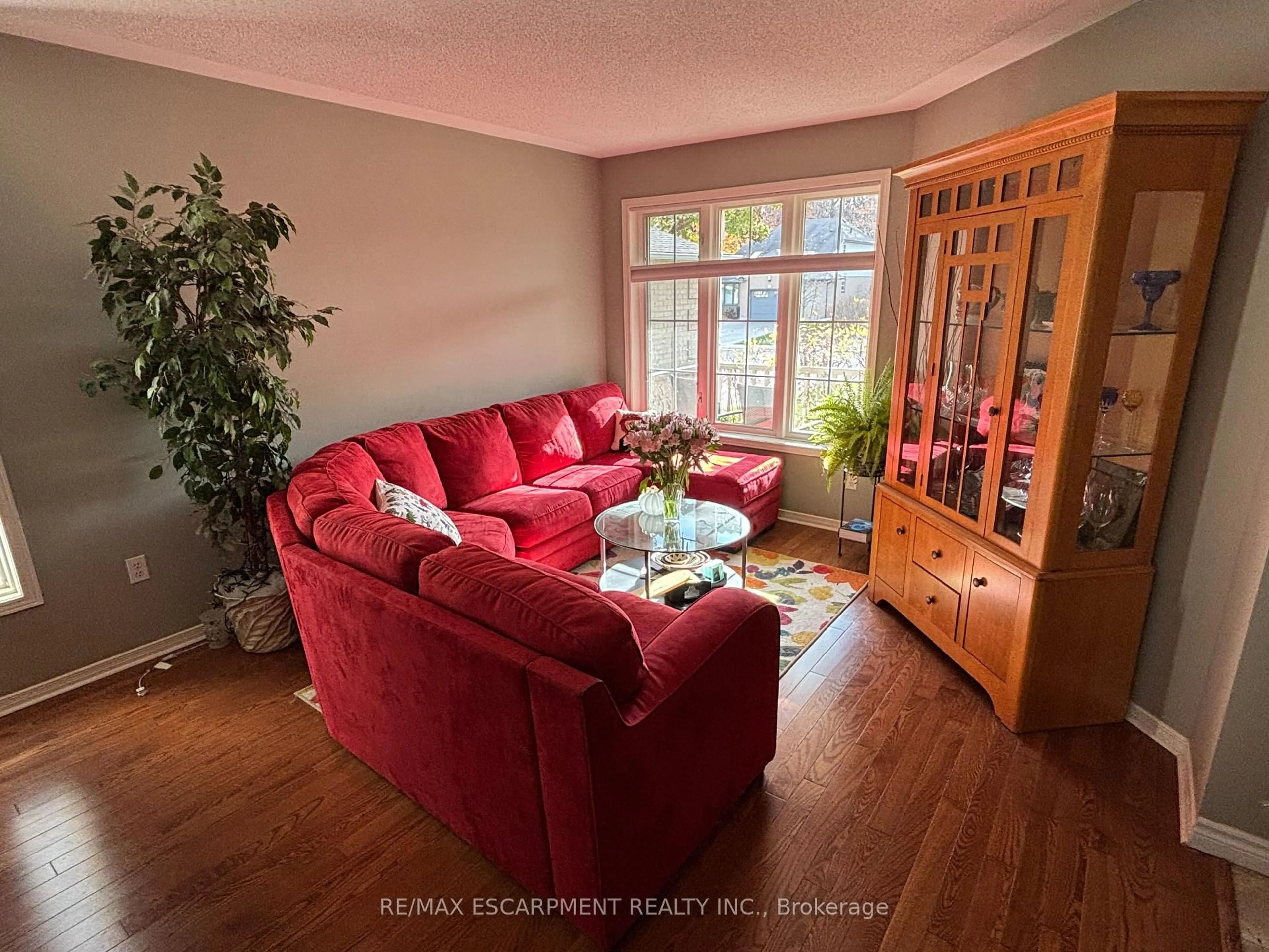 Living room with furniture, wood/laminate floor for 111 Duncairn Cres, Hamilton Ontario L9C 6E9
