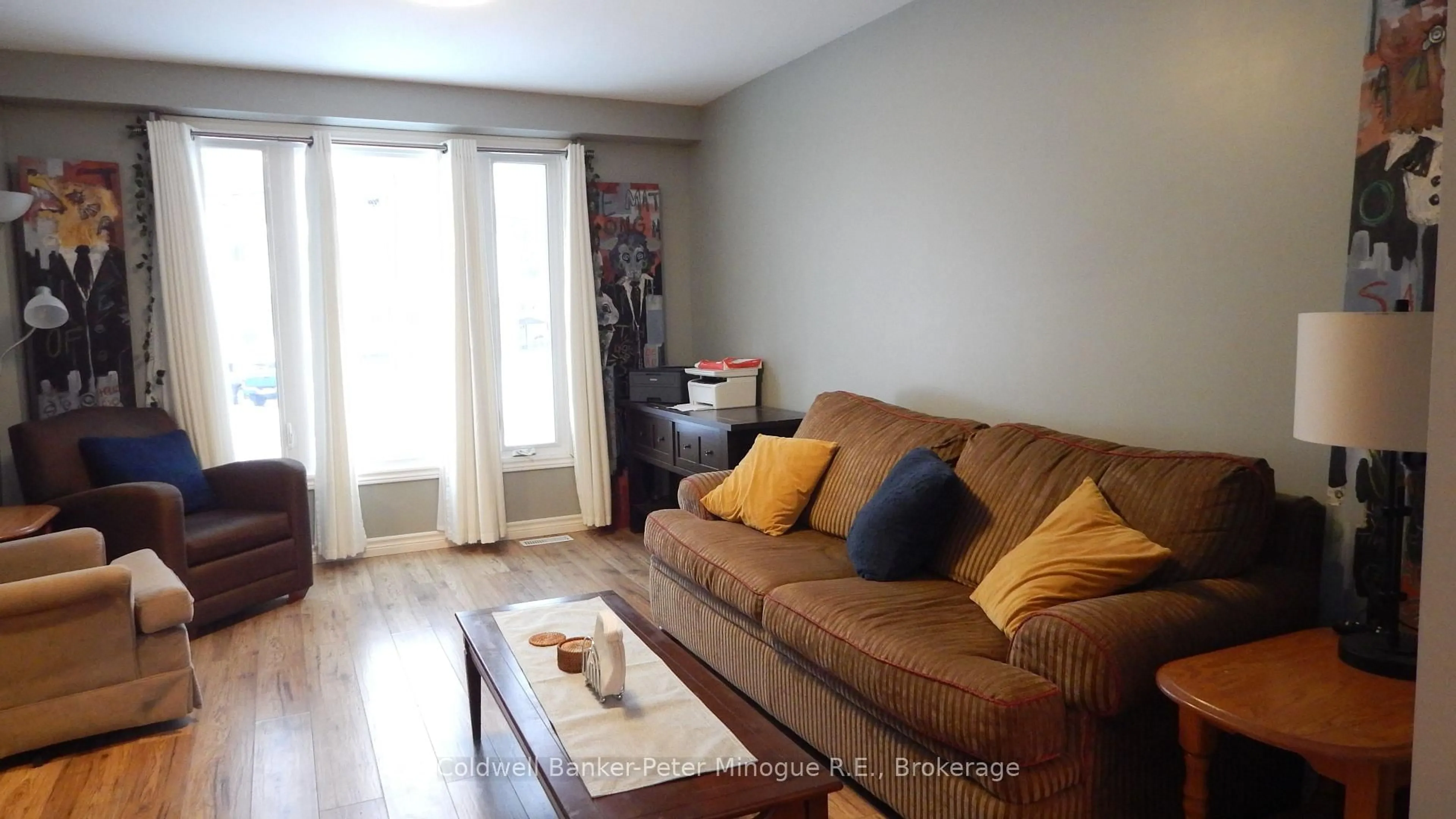 Living room with furniture, wood/laminate floor for 147 Sherryl Cres, North Bay Ontario P1B 8R8