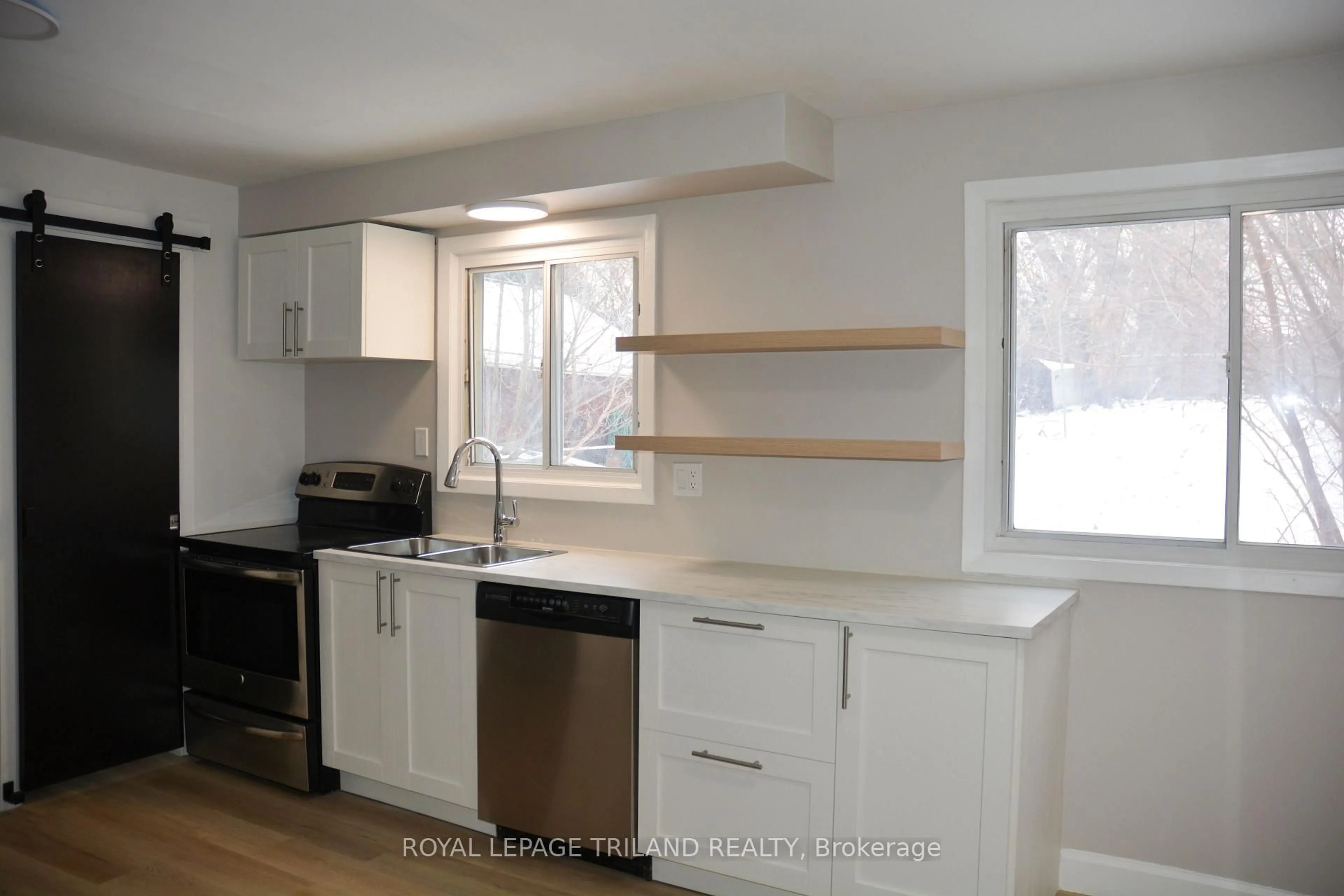 Open concept kitchen, wood/laminate floor for 99 Cecilia Ave, London East Ontario N5Y 3Z9