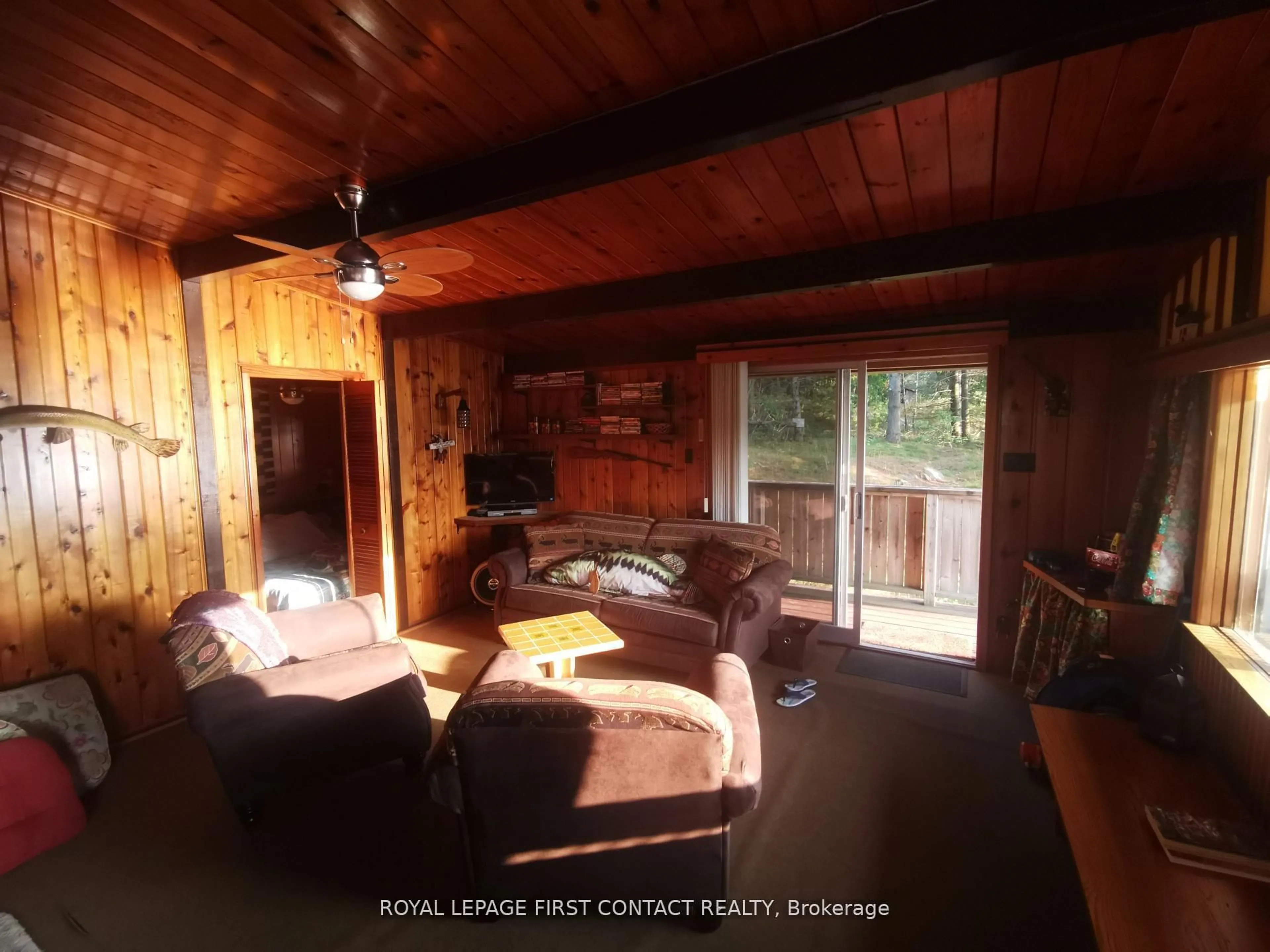 Living room with furniture, wood/laminate floor for 111 Healey Lake Water, The Archipelago Ontario P0C 1H0