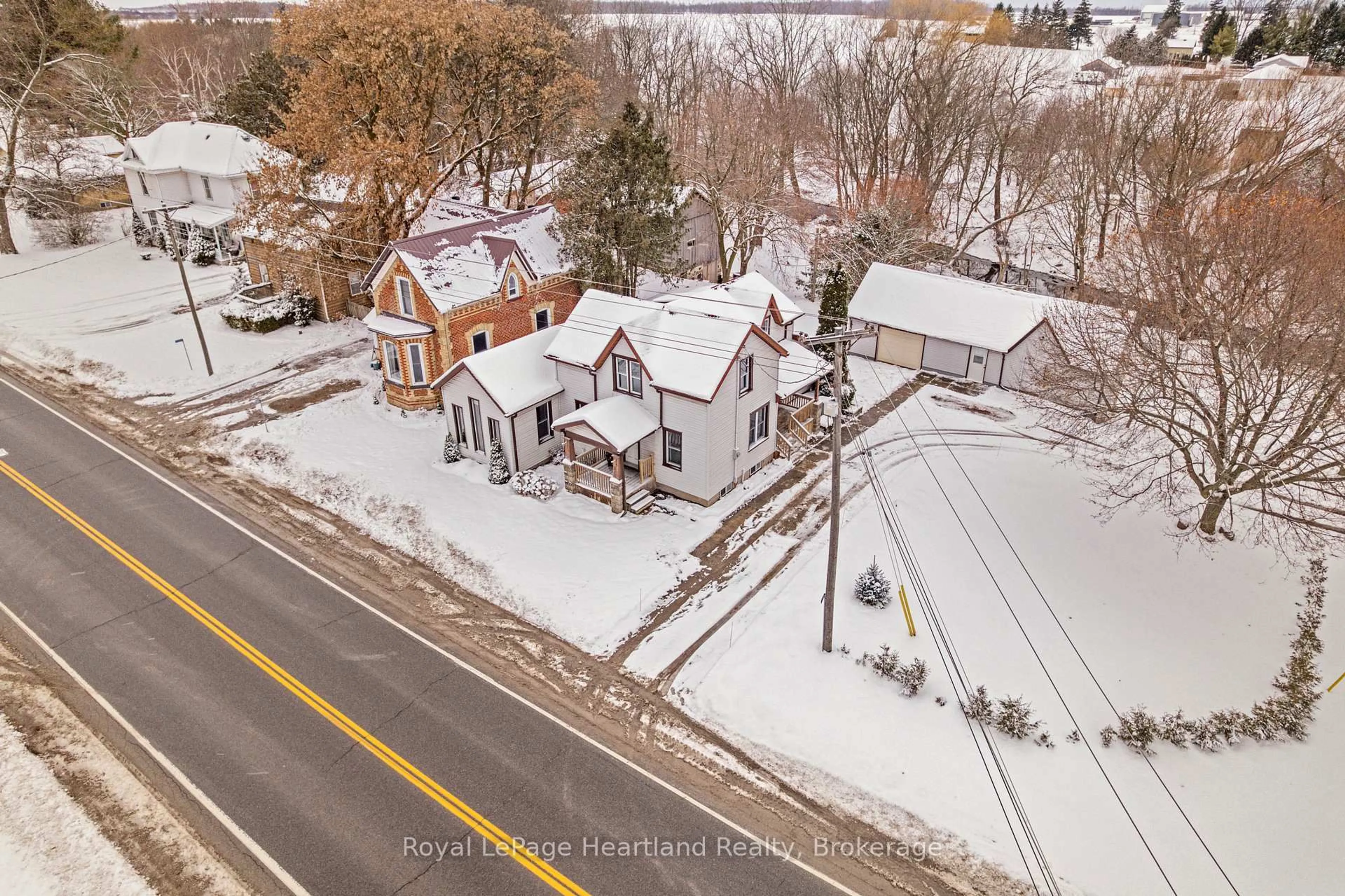 A pic from outside/outdoor area/front of a property/back of a property/a pic from drone, street for 70399 Perth Road 164, South Huron Ontario N0K 1K0