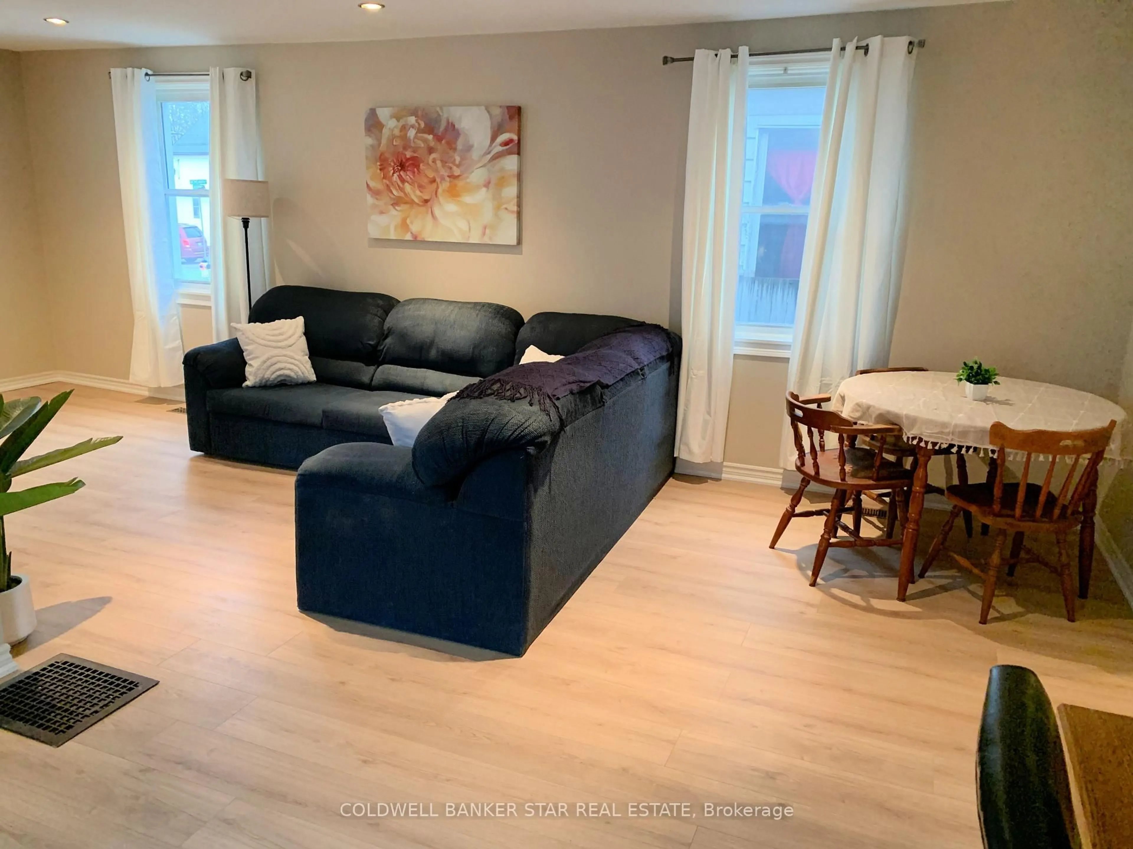 Living room with furniture, wood/laminate floor for 14 Antrim St, St. Thomas Ontario N5P 1S3