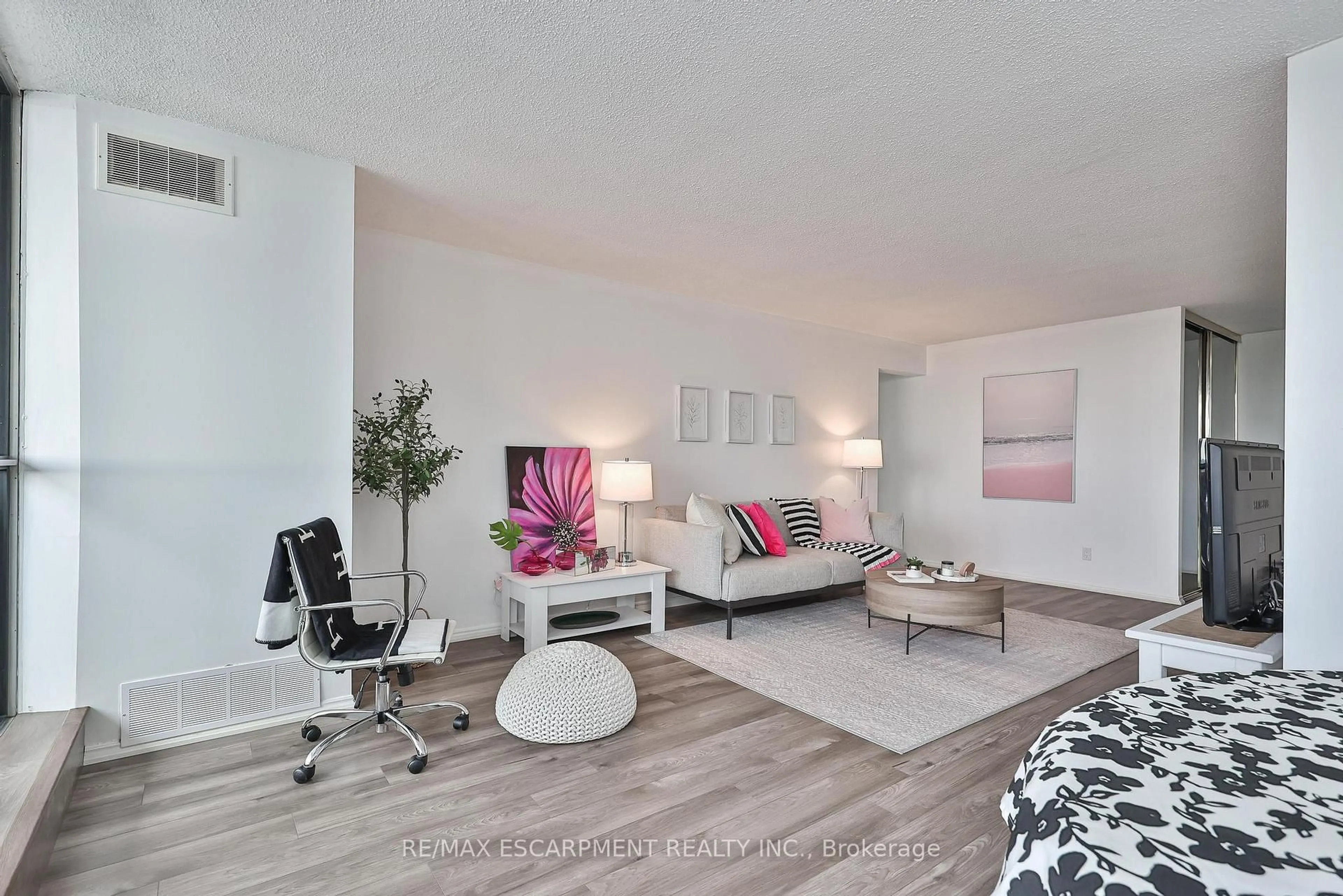 Living room with furniture, wood/laminate floor for 375 King St #1706, Kitchener Ontario N2J 4L6