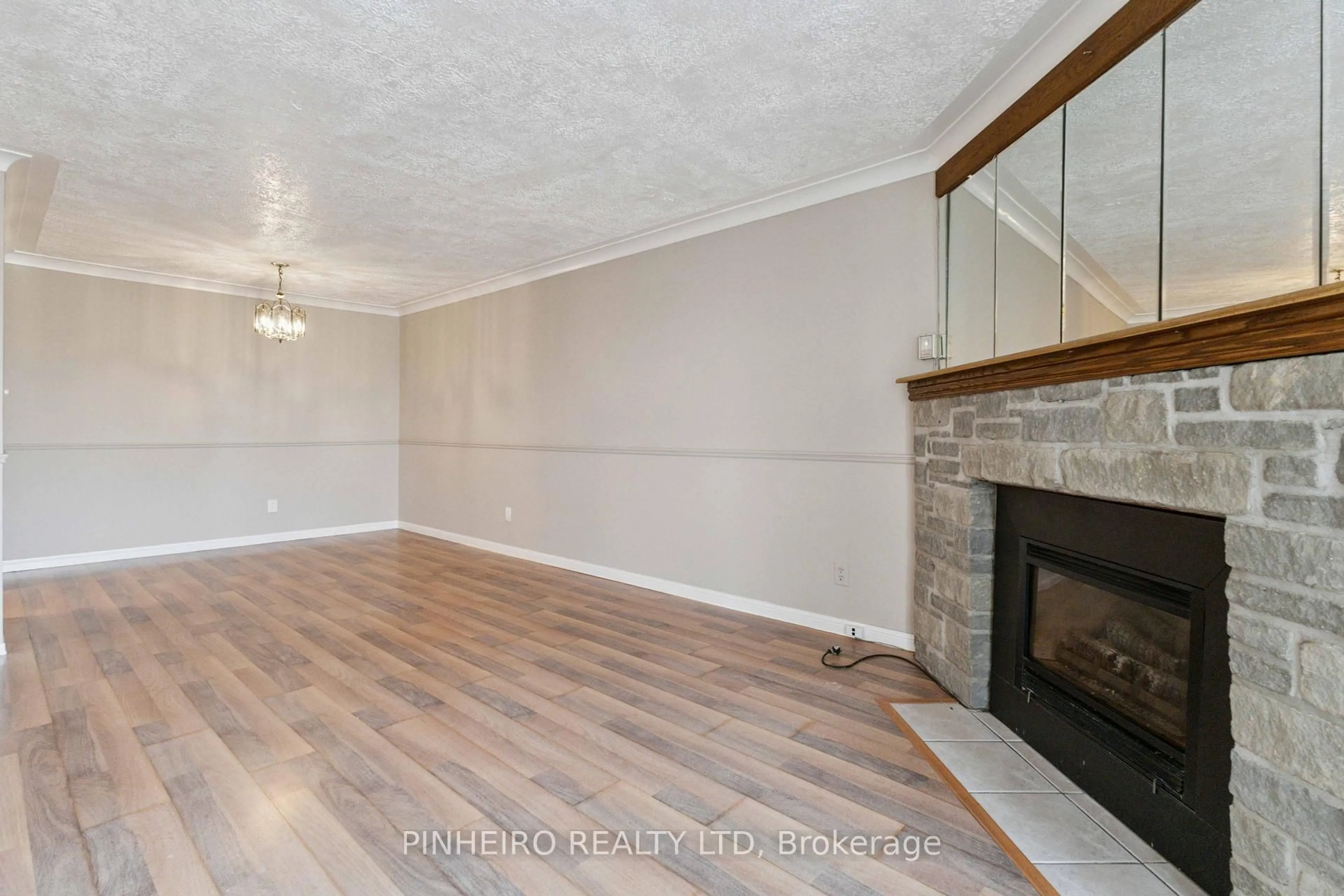 Living room with furniture, wood/laminate floor for 727 Deveron Cres #309, London South Ontario N5Z 4X4