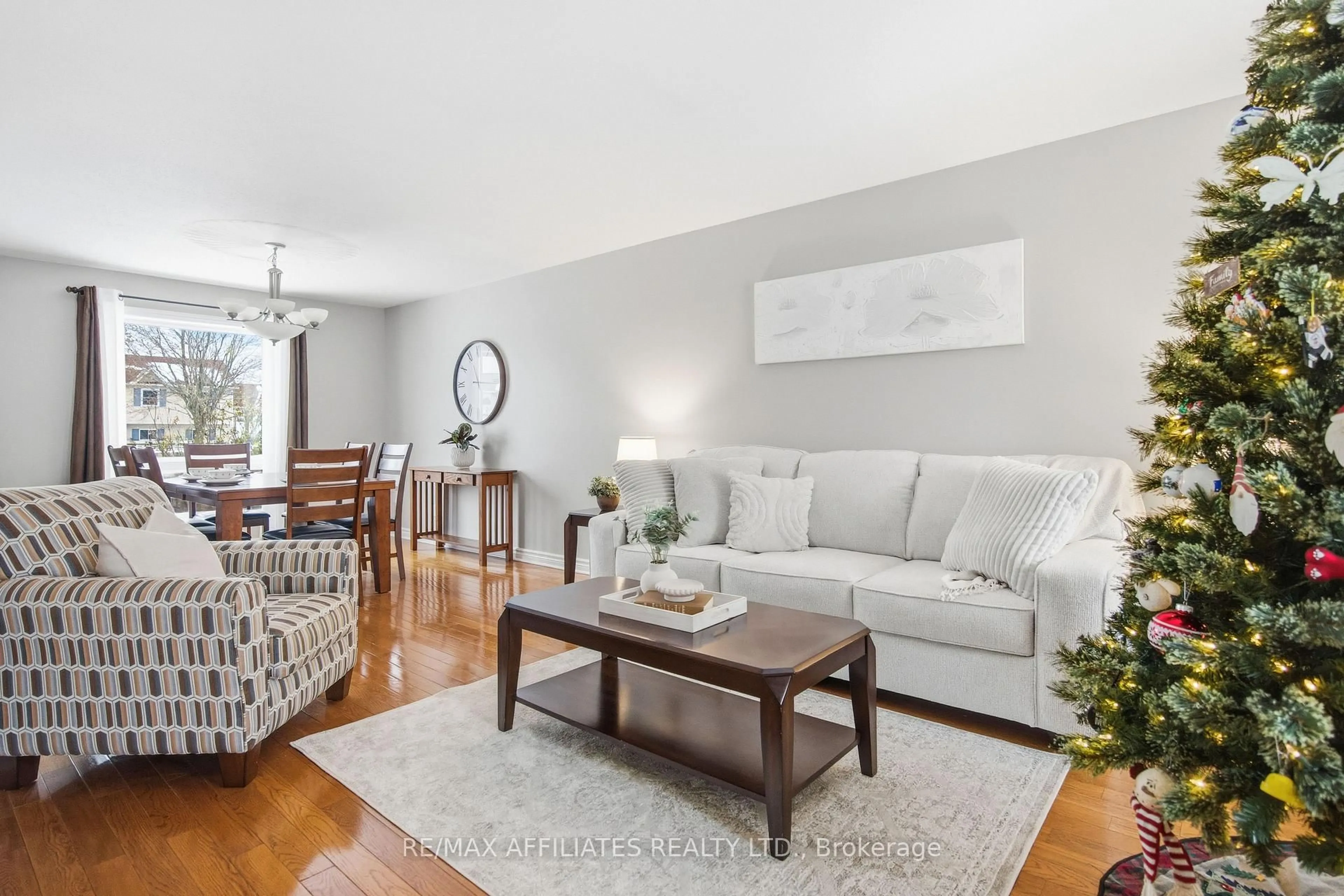 Living room with furniture, wood/laminate floor for 27 Comba Dr, Carleton Place Ontario K7C 4V2