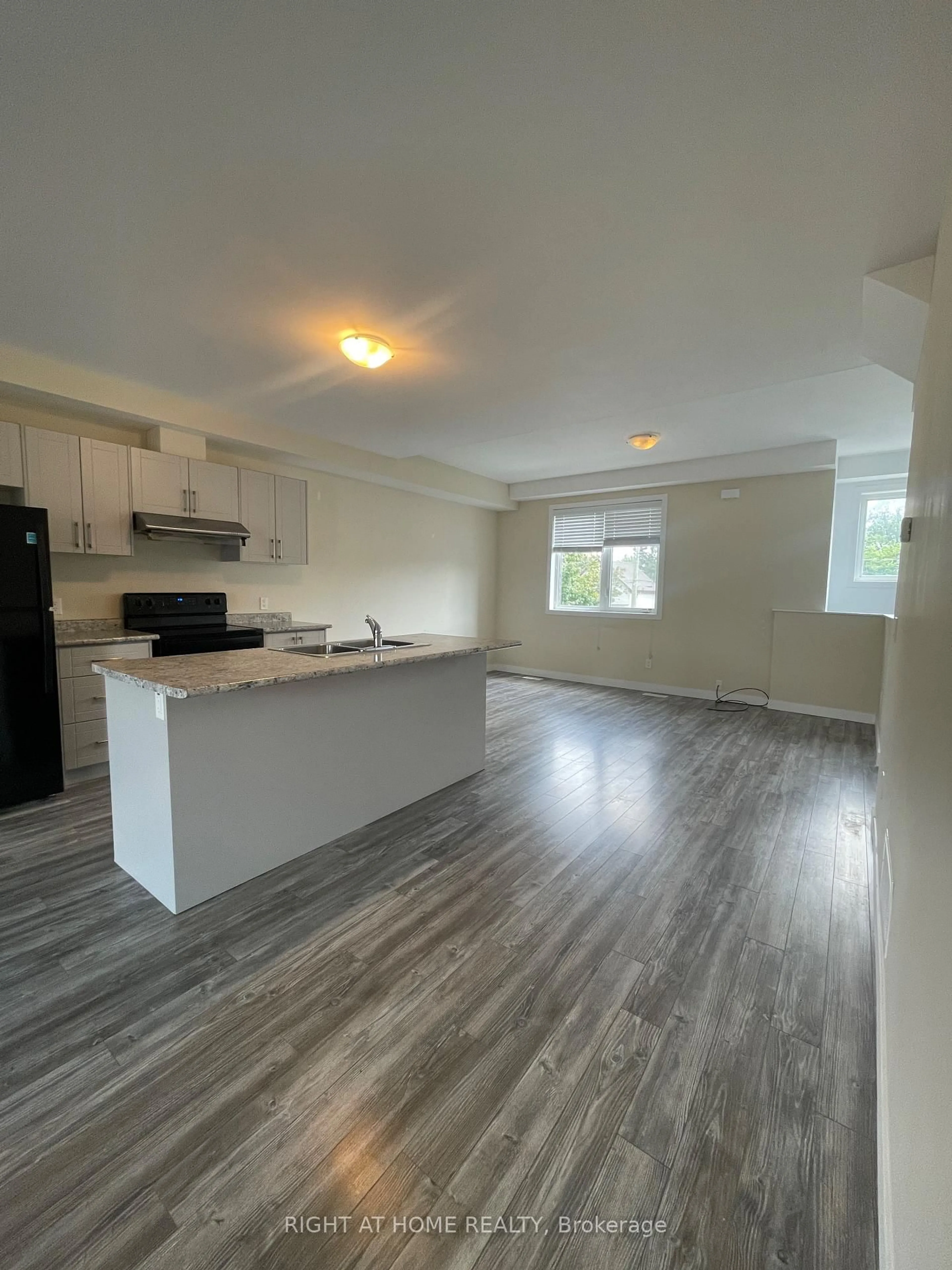 Open concept kitchen, wood/laminate floor for 59 Denistoun St, Welland Ontario L3C 0H6