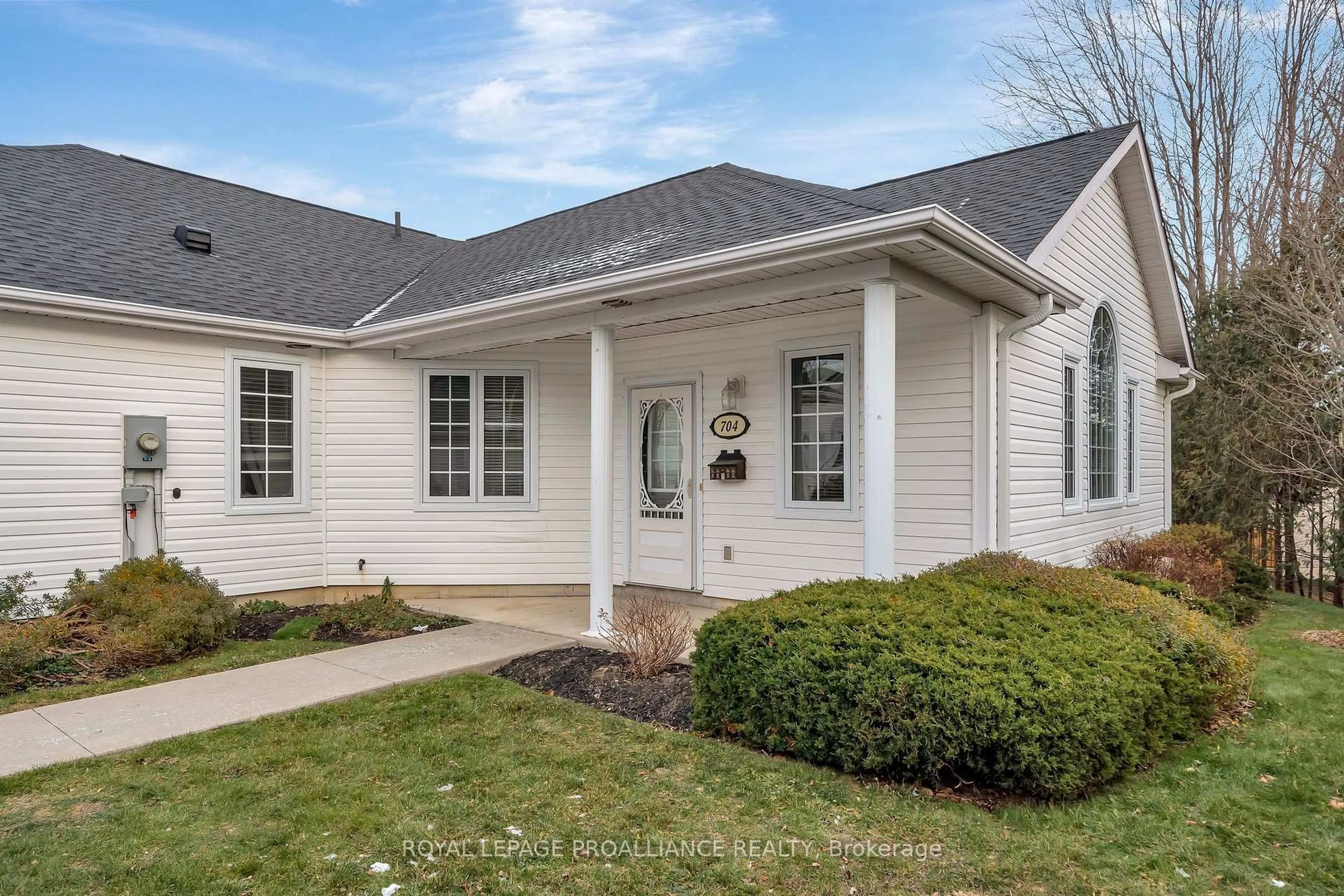 Home with vinyl exterior material, street for 1055 Birchwood Tr #704, Cobourg Ontario K9A 5Y2