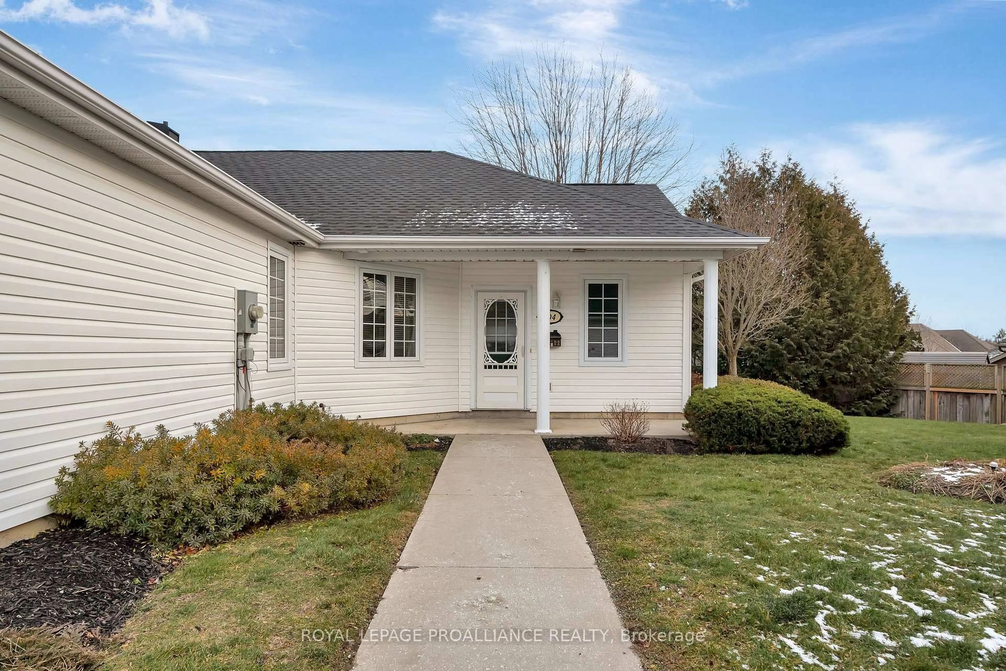 Home with vinyl exterior material, street for 1055 Birchwood Tr #704, Cobourg Ontario K9A 5Y2