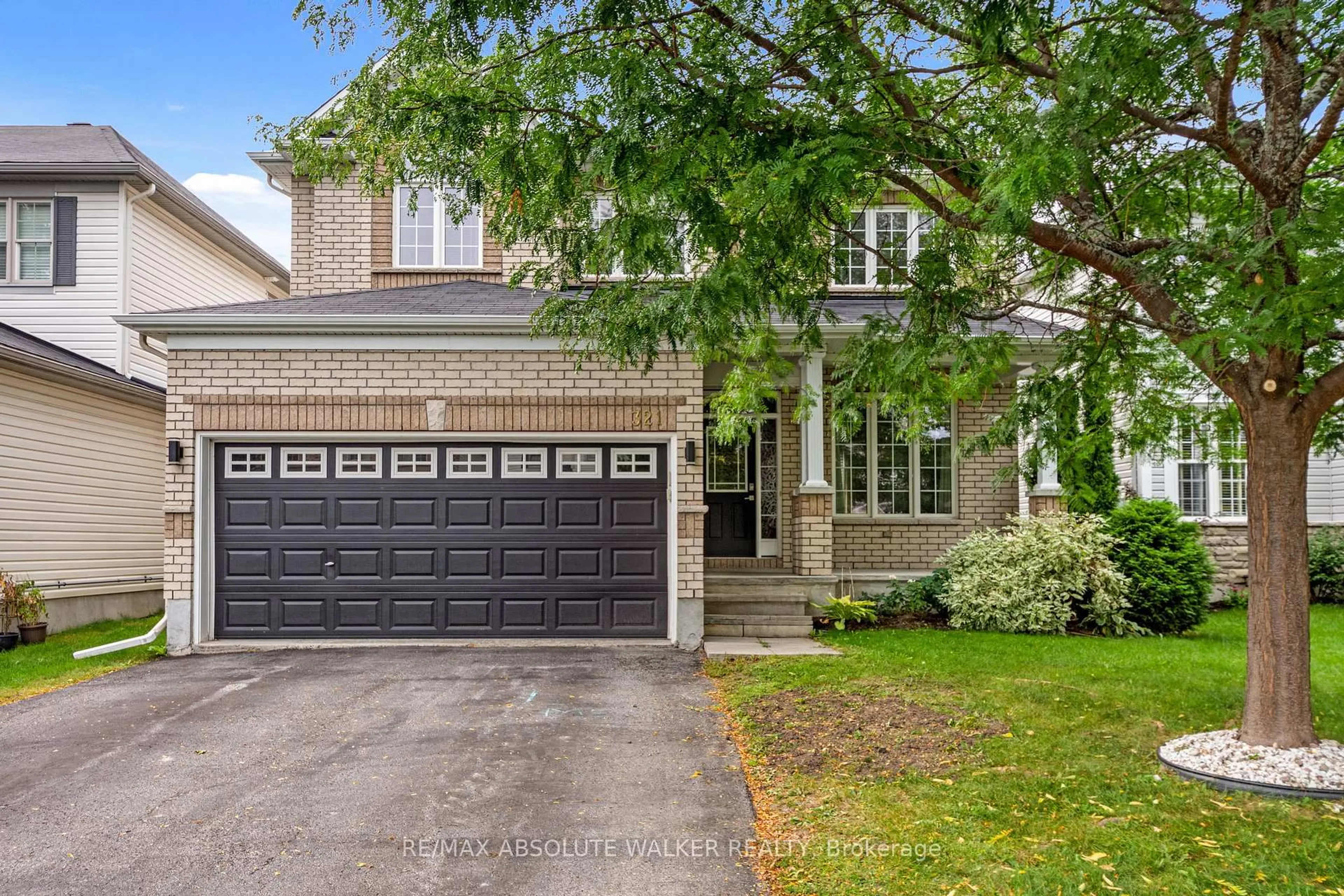 Home with brick exterior material, street for 321 Upcountry Dr, Ottawa Ontario K2S 2H6
