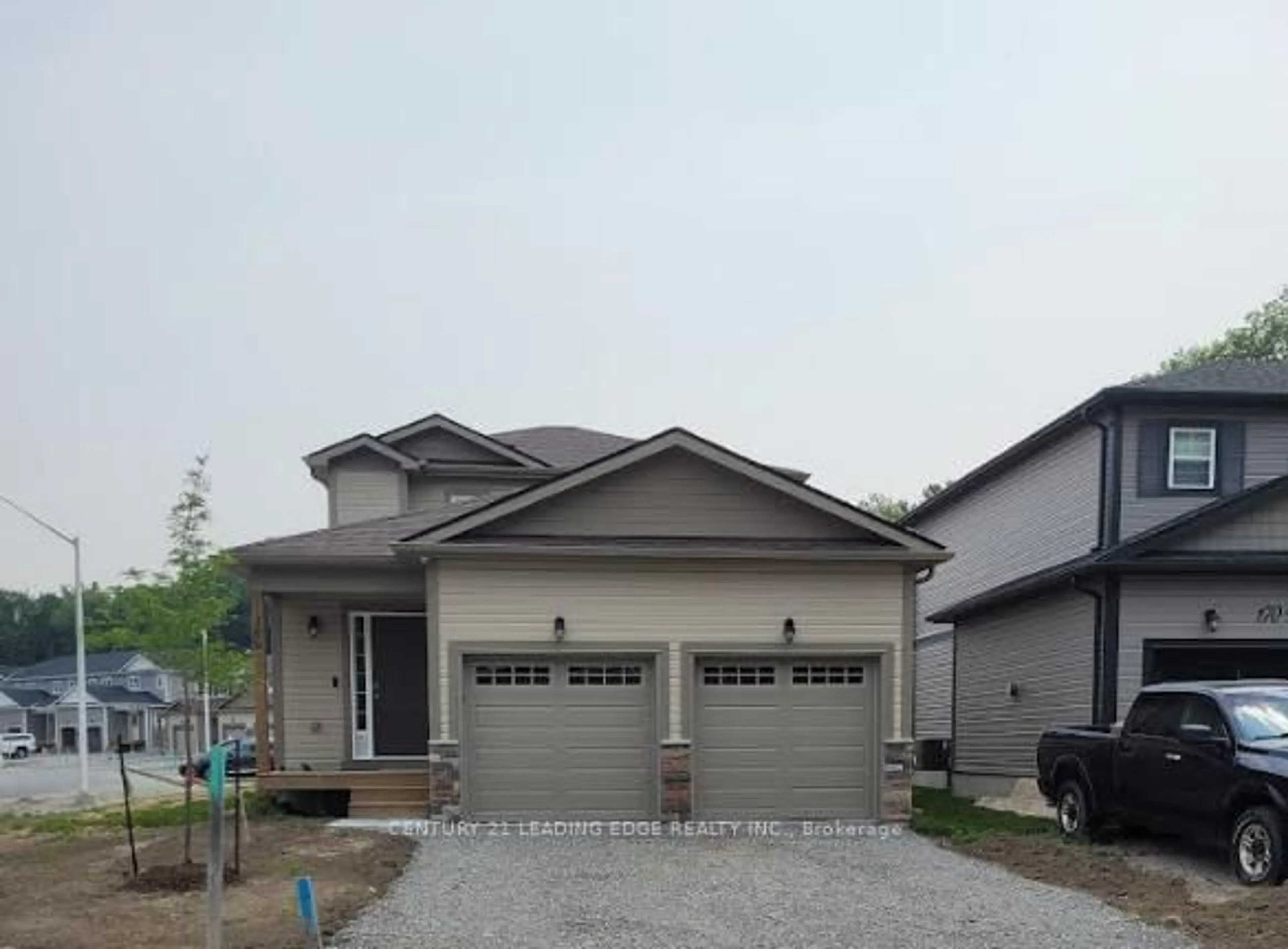 Home with vinyl exterior material, street for 180 Wild Rose Dr, Gravenhurst Ontario P1P 0B4