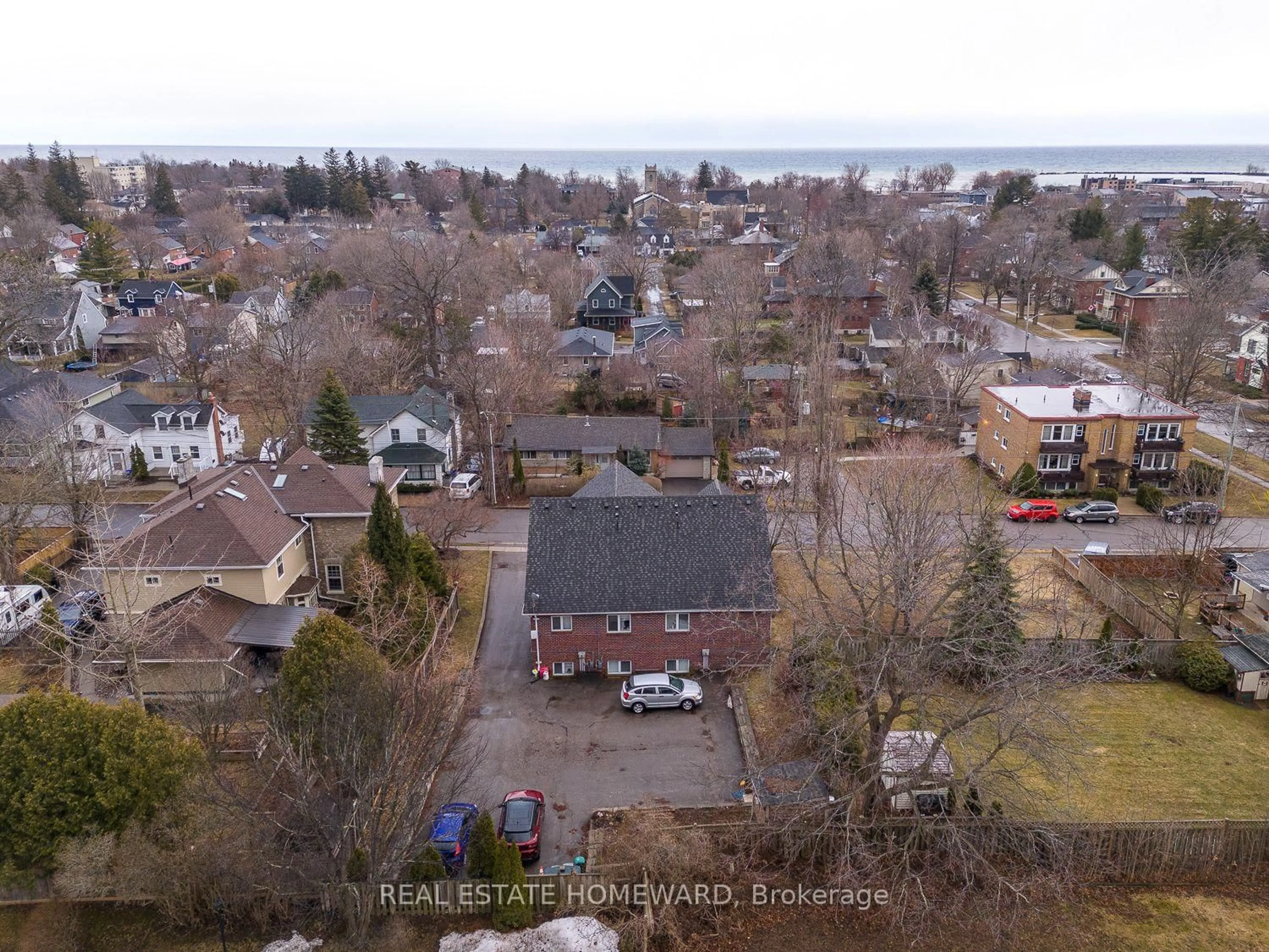 A pic from outside/outdoor area/front of a property/back of a property/a pic from drone, water/lake/river/ocean view for 106 Anne St #102, Cobourg Ontario K9A 1G5