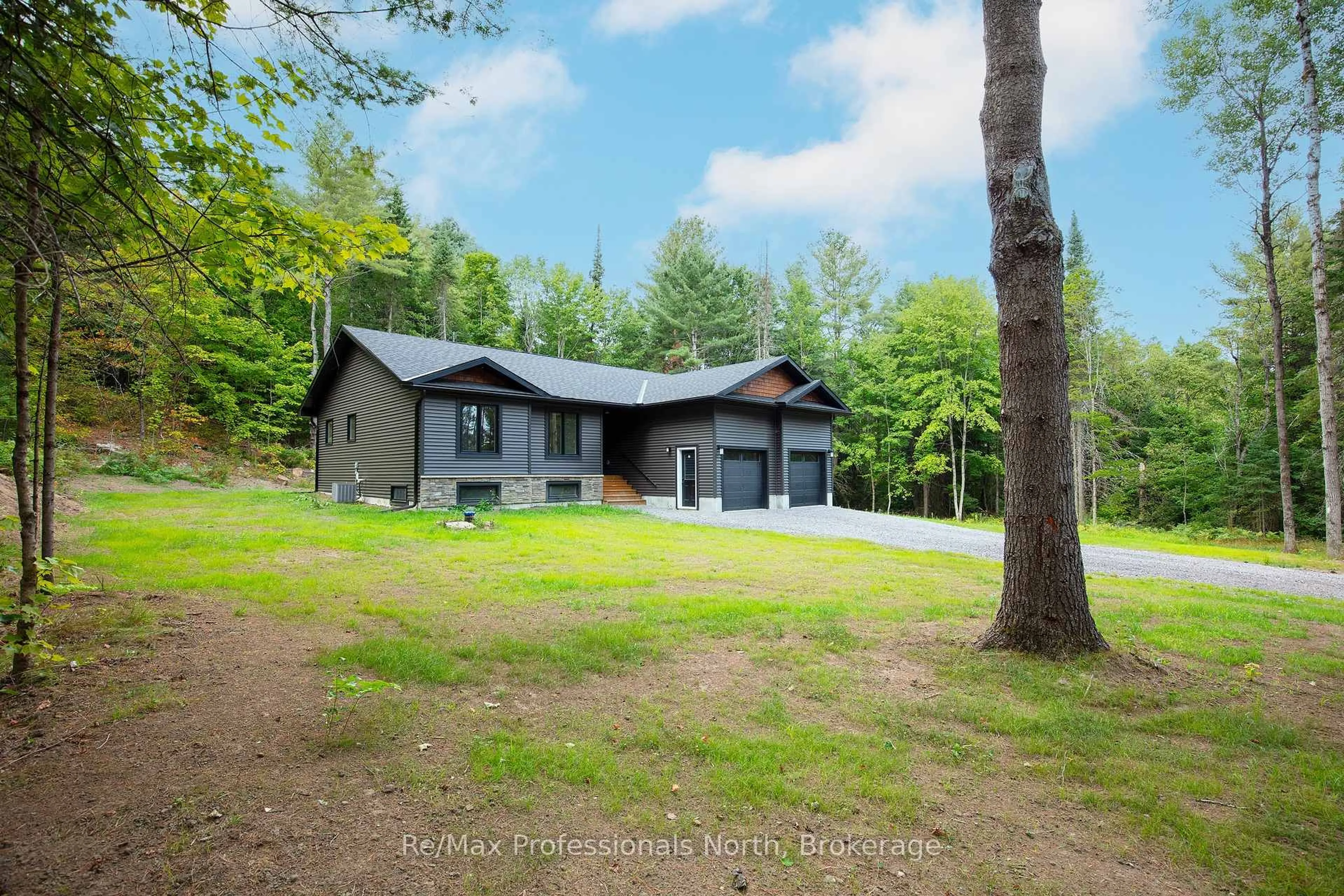 A pic from outside/outdoor area/front of a property/back of a property/a pic from drone, forest/trees view for 260 STEPHENSON 2 Rd, Huntsville Ontario P0B 1M0