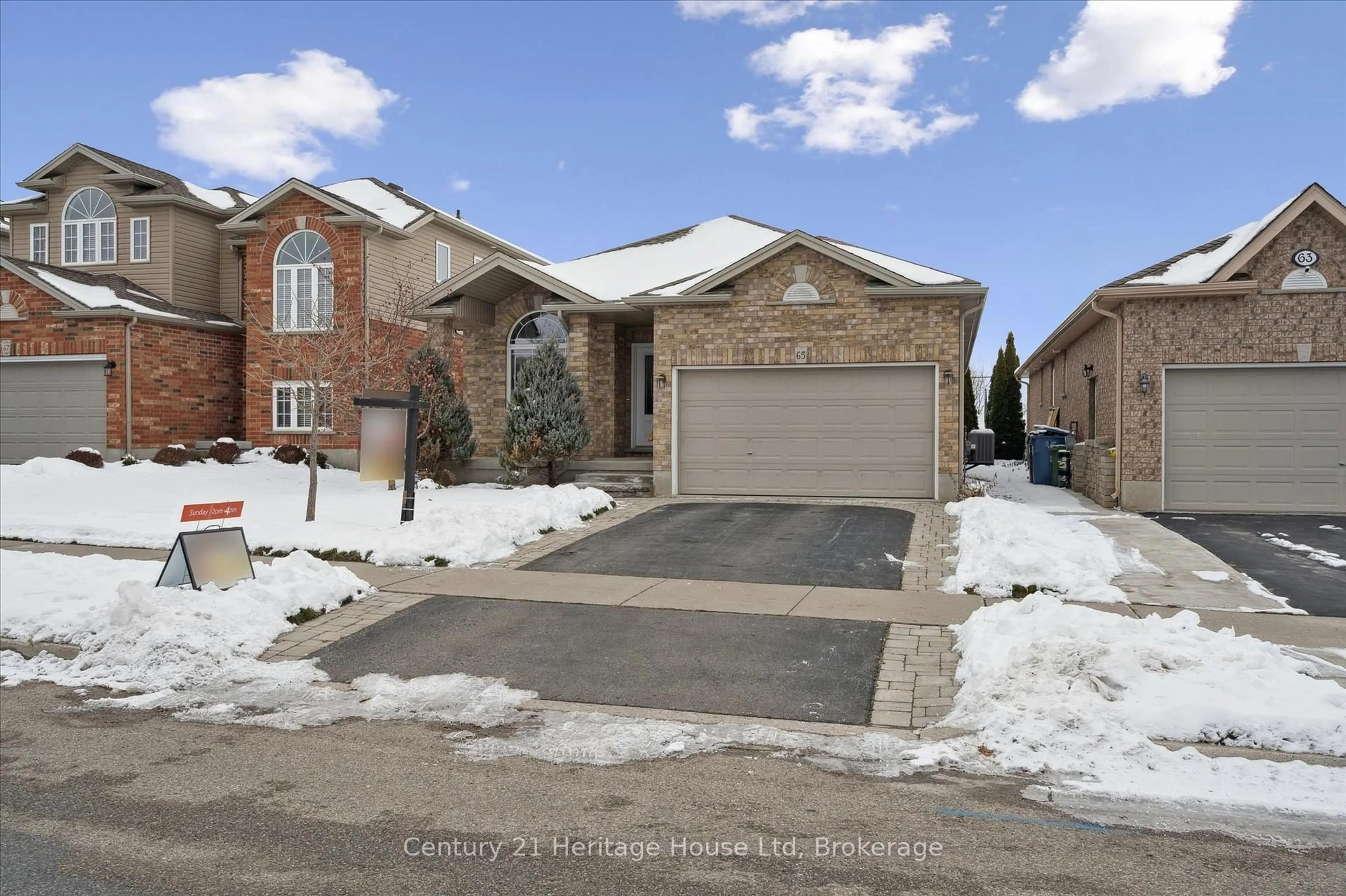 Home with brick exterior material, street for 65 Norton Dr, Guelph Ontario N1E 7K8